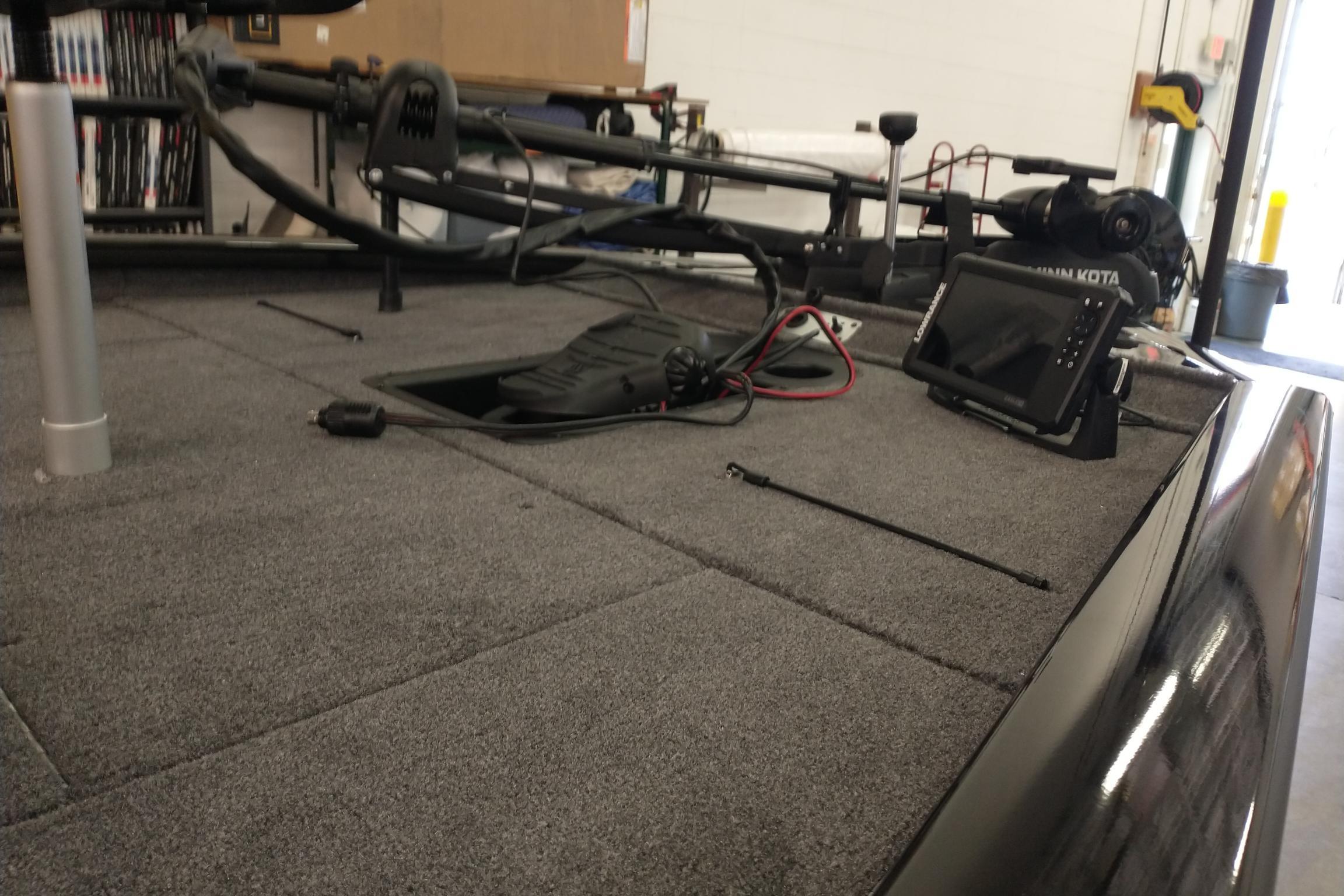 2026 Tracker Pro Team 195 boat interior with fishing equipment and electronics.