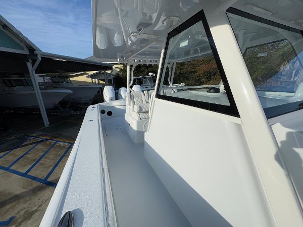 2025 Yellowfin 39 Offshore boat in marina, showcasing sleek design and spacious deck.
