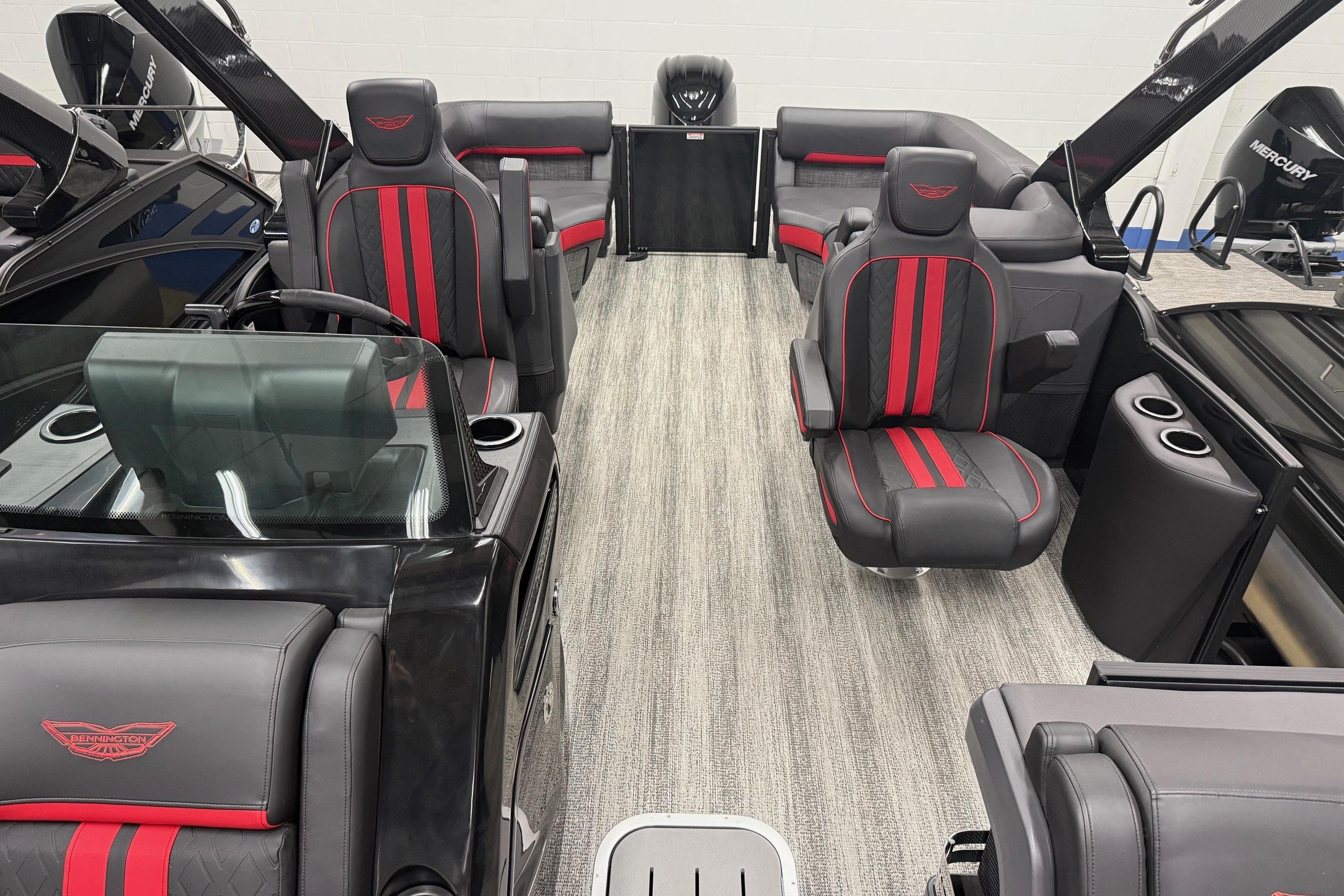 2025 Bennington M Line boat interior with sleek black and red seating design.