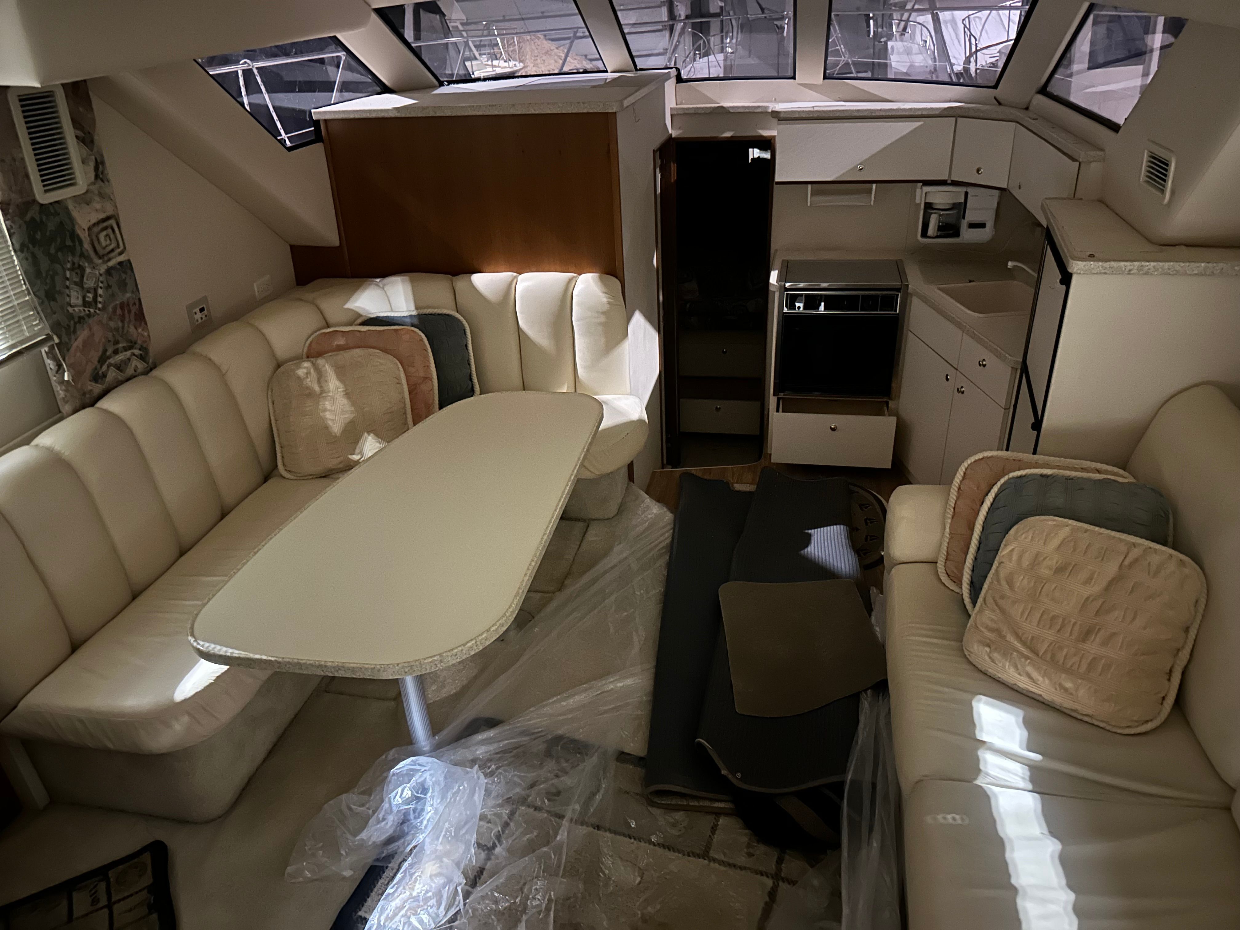 Interior of a 1998 Silverton 351 Sedan yacht with leather sofas.