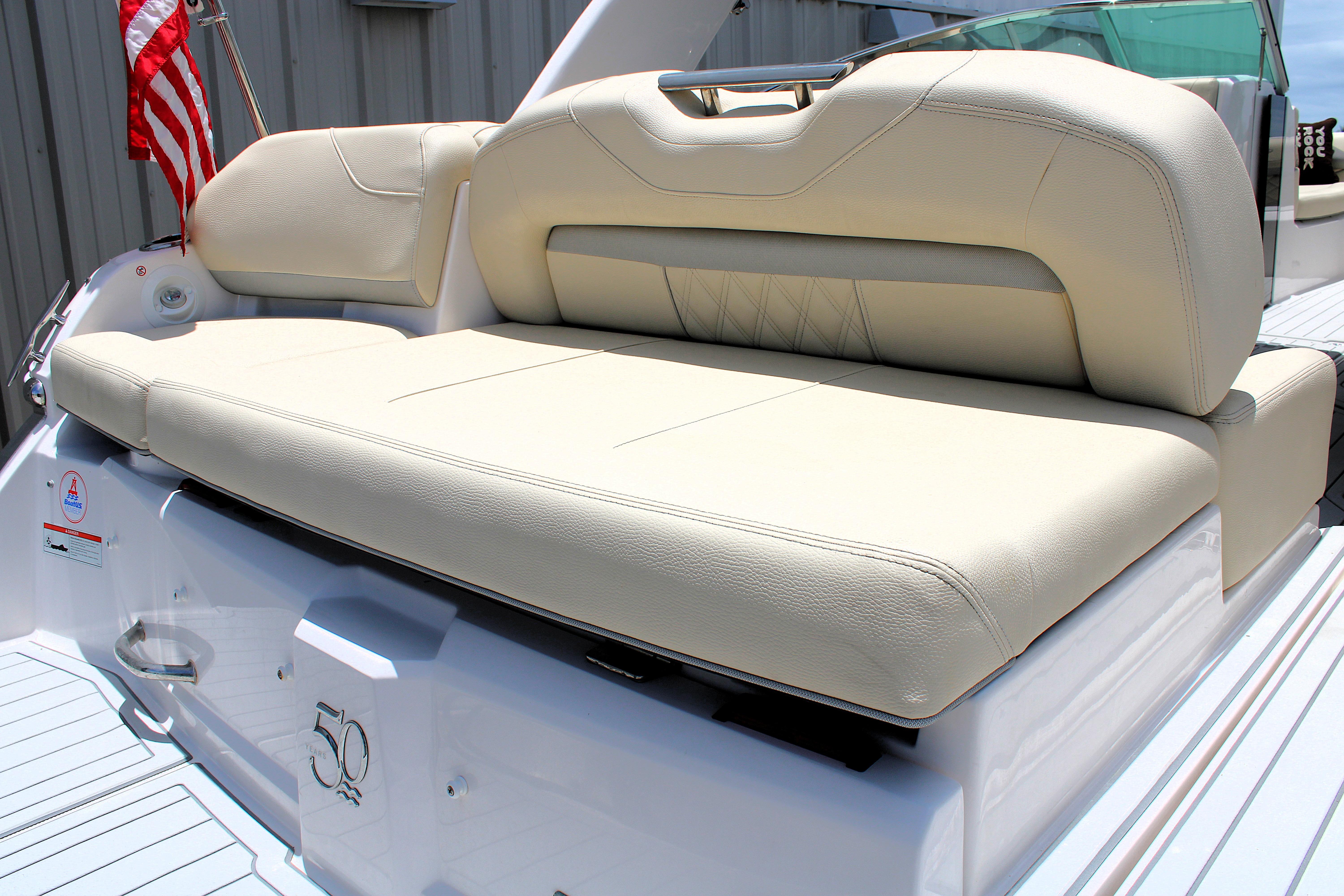 2021 Regal 26 OBX boat with beige seating and American flag.