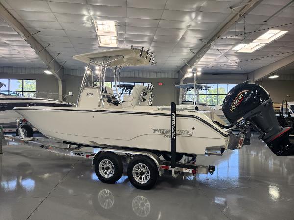 2025 Pathfinder 2400 Open boat in showroom, side view, on trailer.
