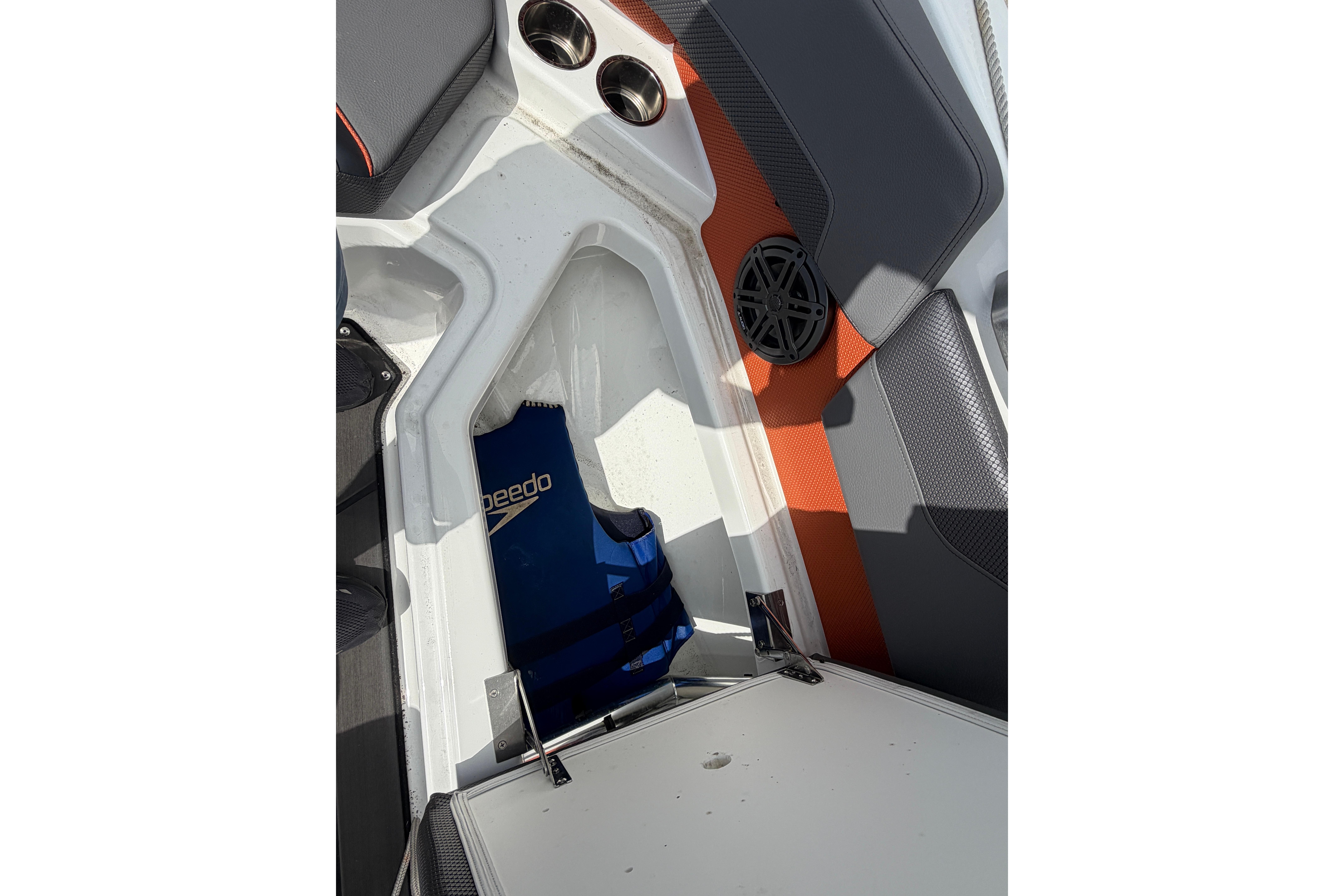 Interior of 2026 Scarab 235 LX boat with seating and speaker detail.