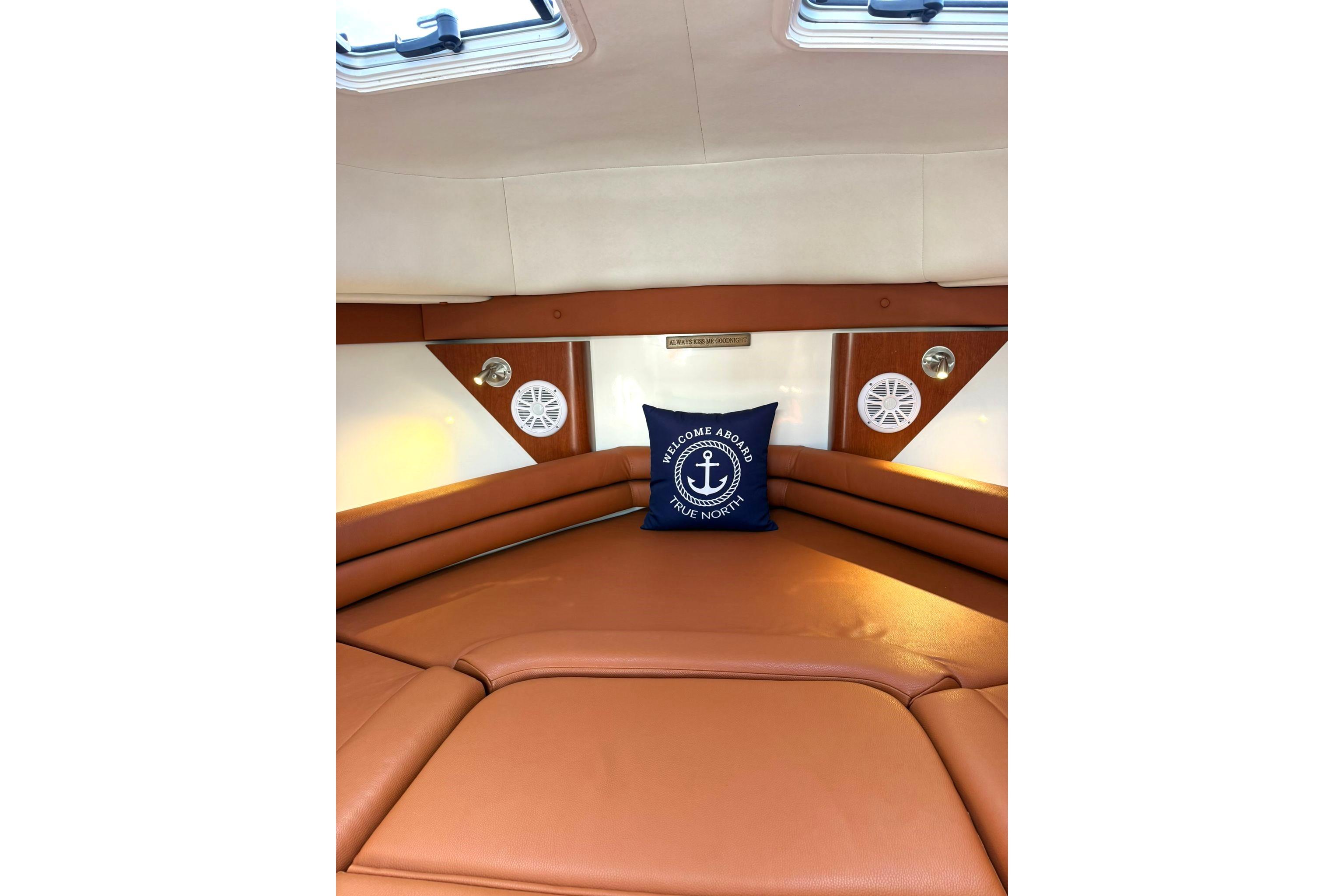 Luxurious cabin interior of 2006 Pro-Line 32 Express boat with plush seating.