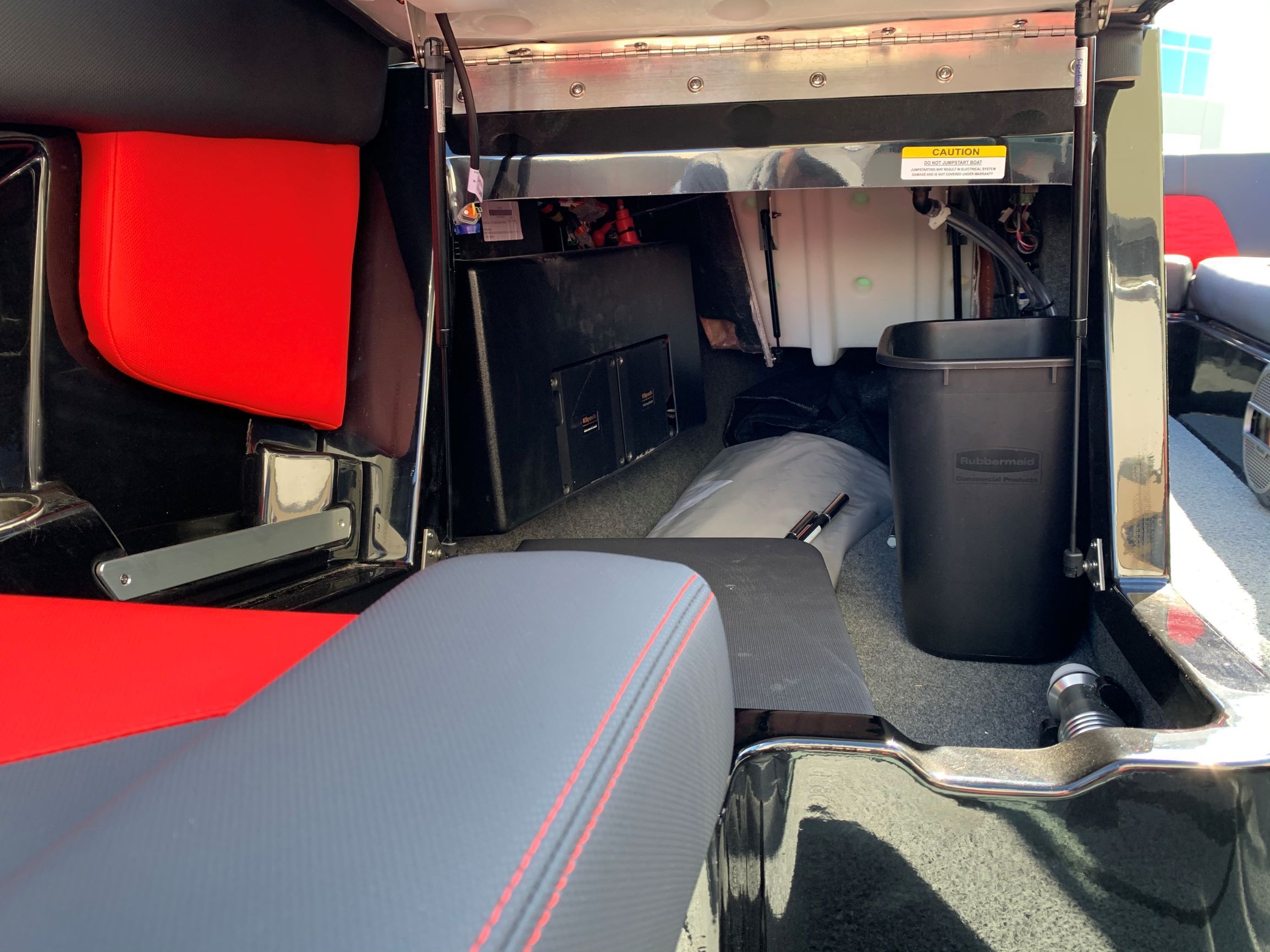 Interior of a 2020 MasterCraft X24 with red and black seating.
