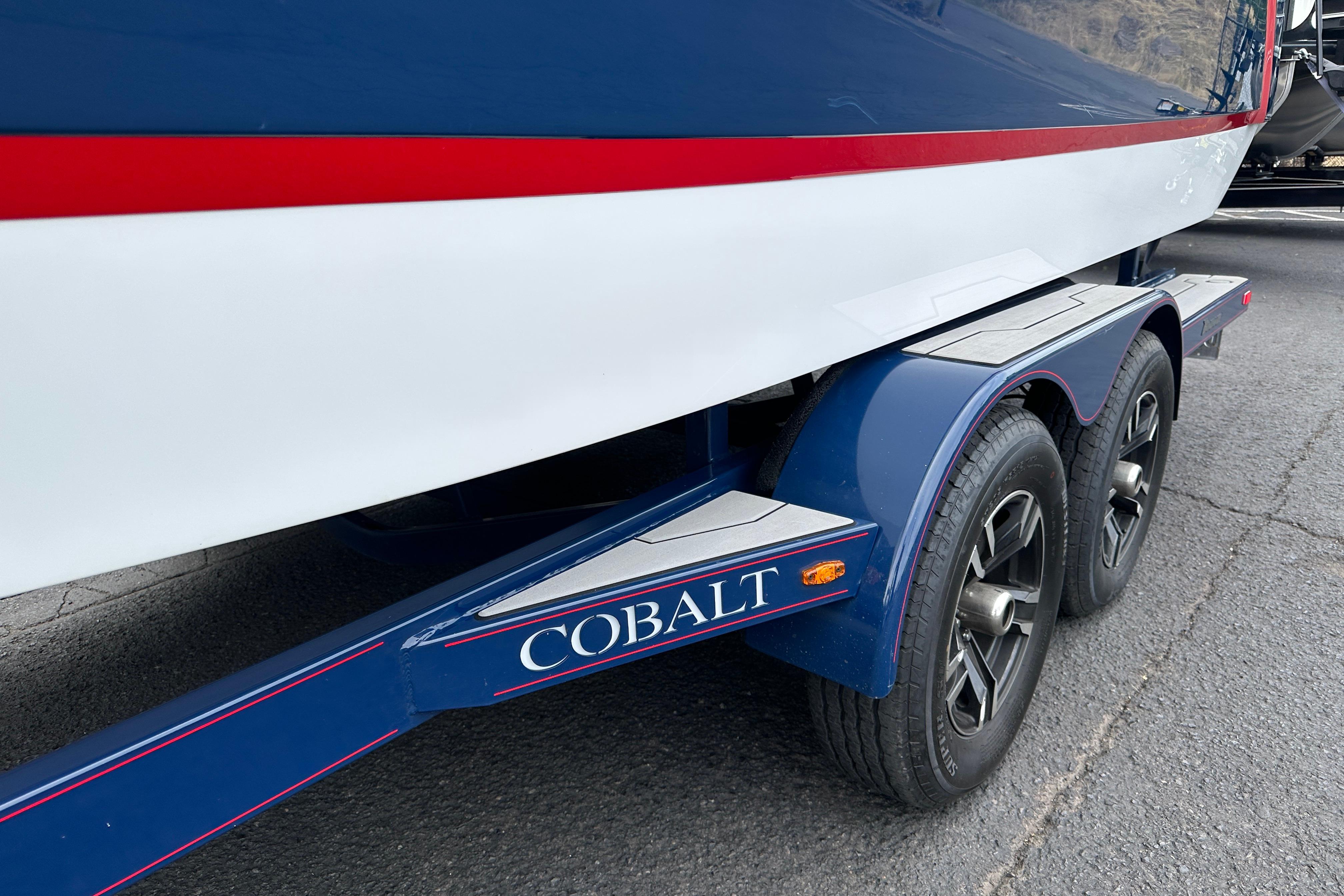 2019 Cobalt R5 boat on trailer, featuring blue and red accents.