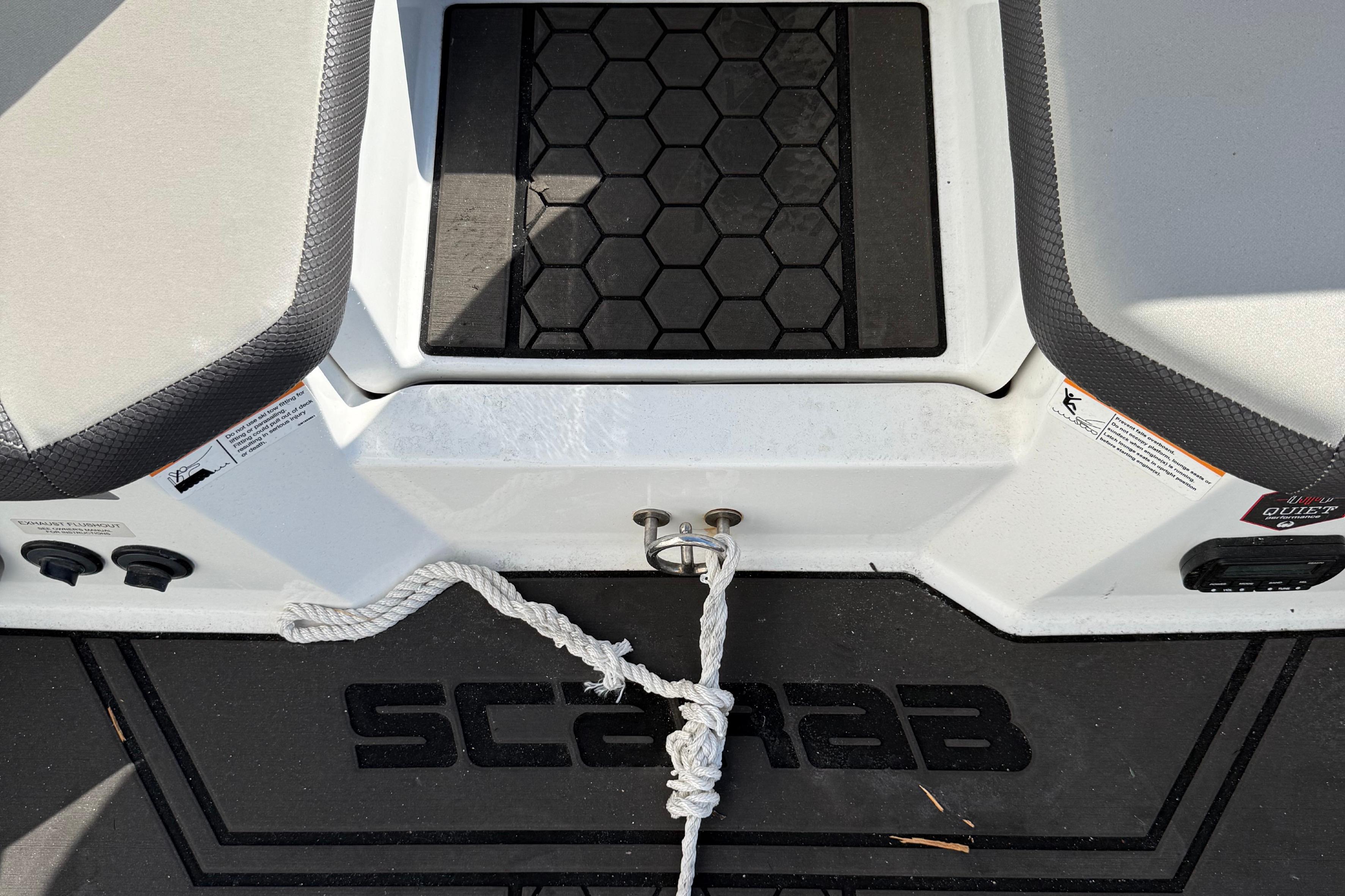 2021 Scarab 255 ID boat interior with rope and hexagonal mat design.