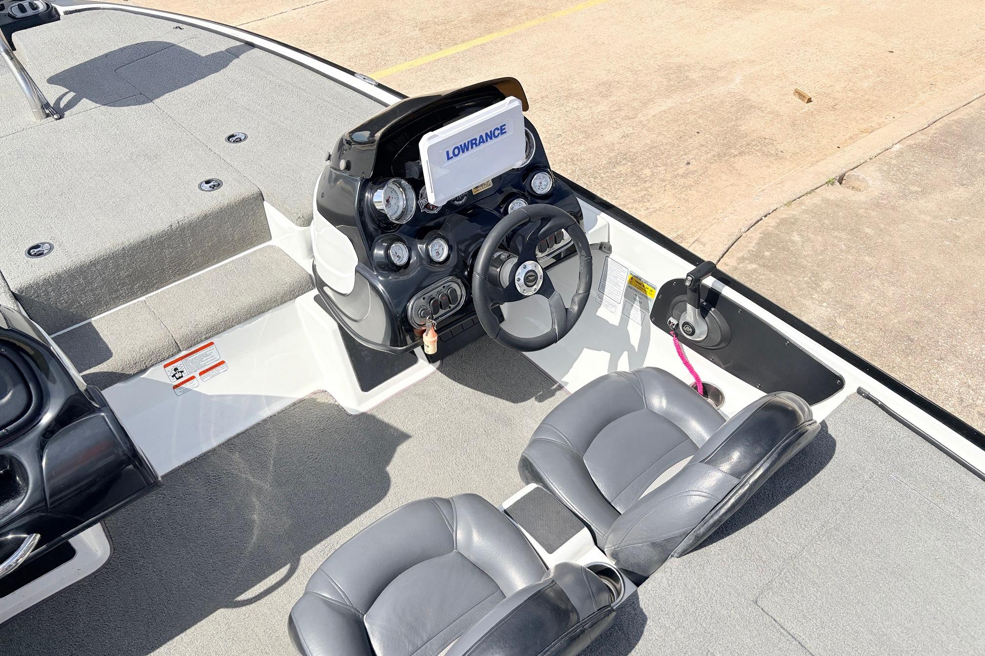 Interior of a 2011 Nitro Z-7 boat with steering console and seating.