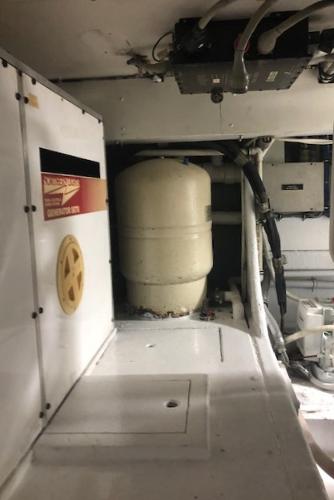 1997 Bertram Convertible engine room with equipment and machinery.