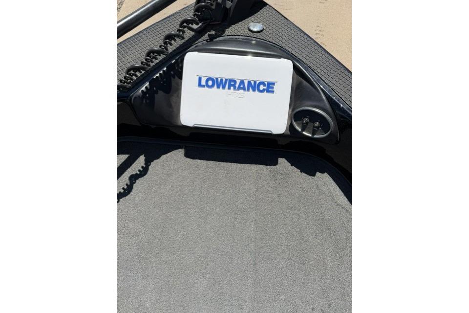 2016 Triton 216 Fishunter boat with Lowrance GPS system on deck.