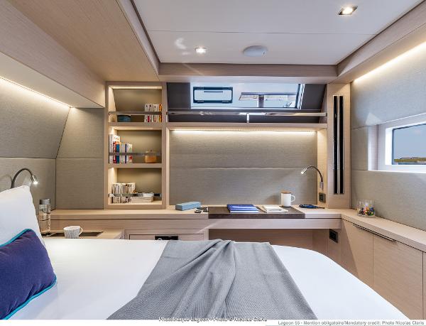 Luxurious interior of 2025 Lagoon 55 yacht cabin with modern design and ambient lighting.