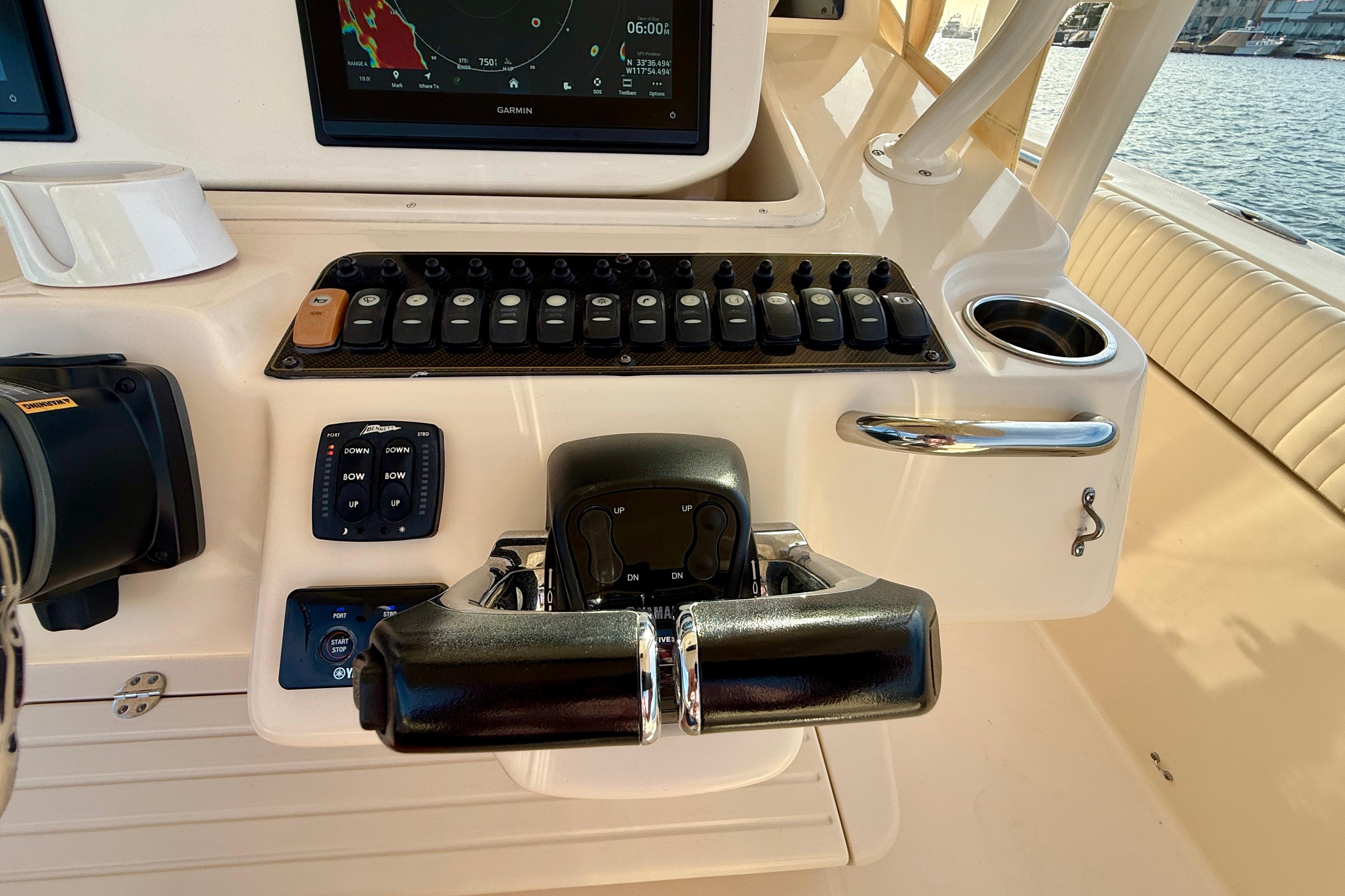 Control panel of a 2012 Grady-White Canyon 336 boat with navigation display.