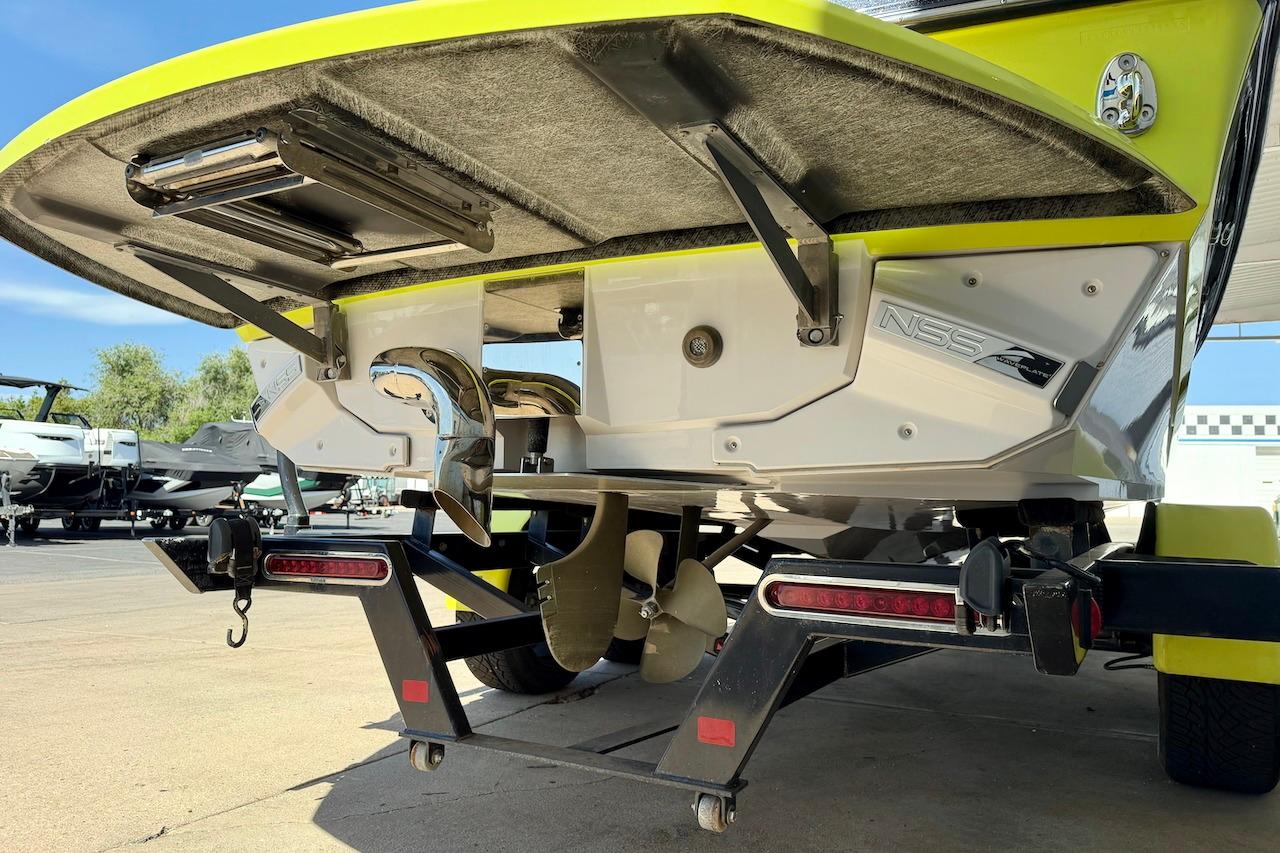 2014 Nautique Super Air Nautique G21 boat rear view with trailer and propeller.