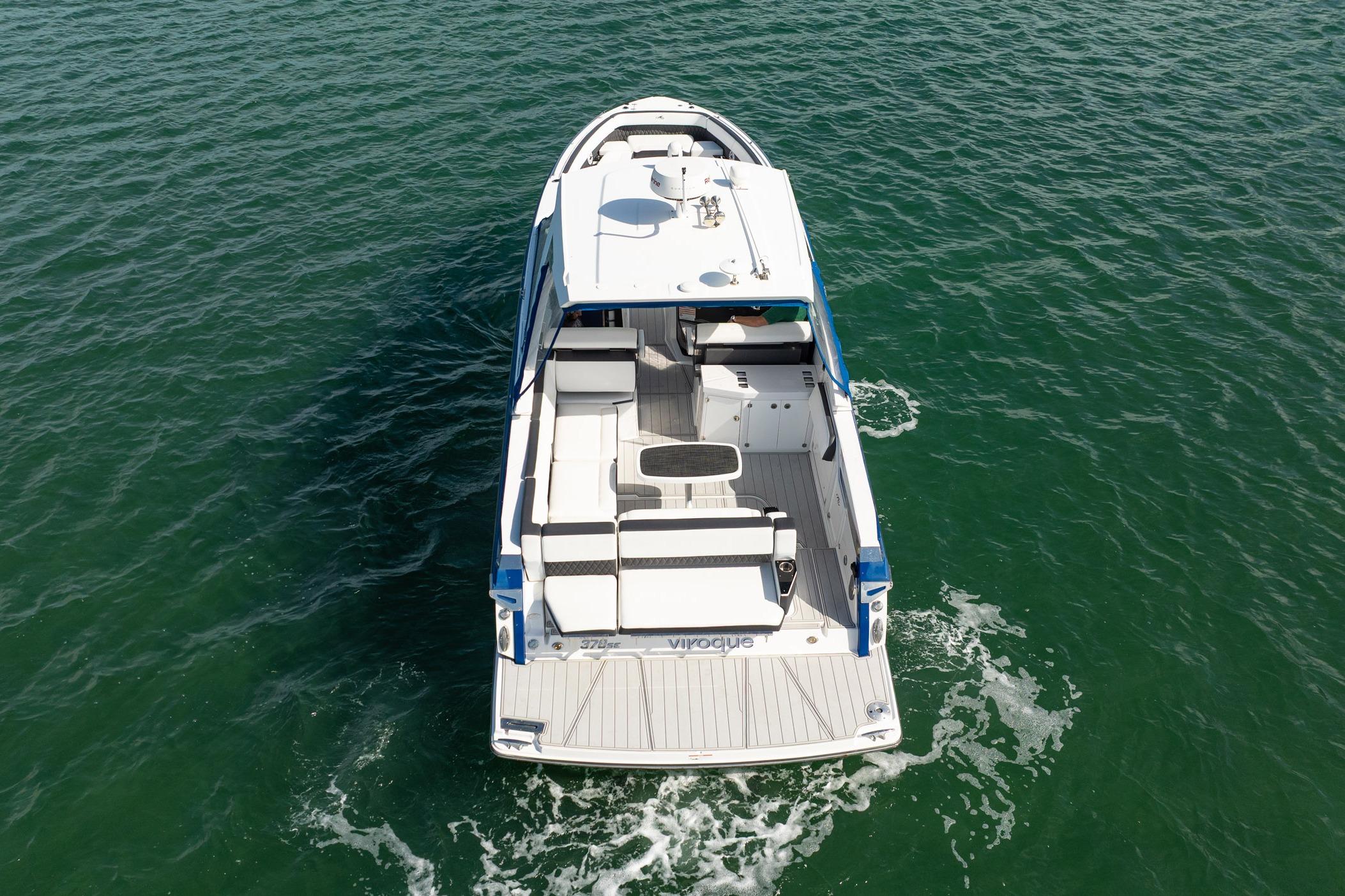 Aerial view of 2021 Monterey 378SE Super Express boat cruising on open water.