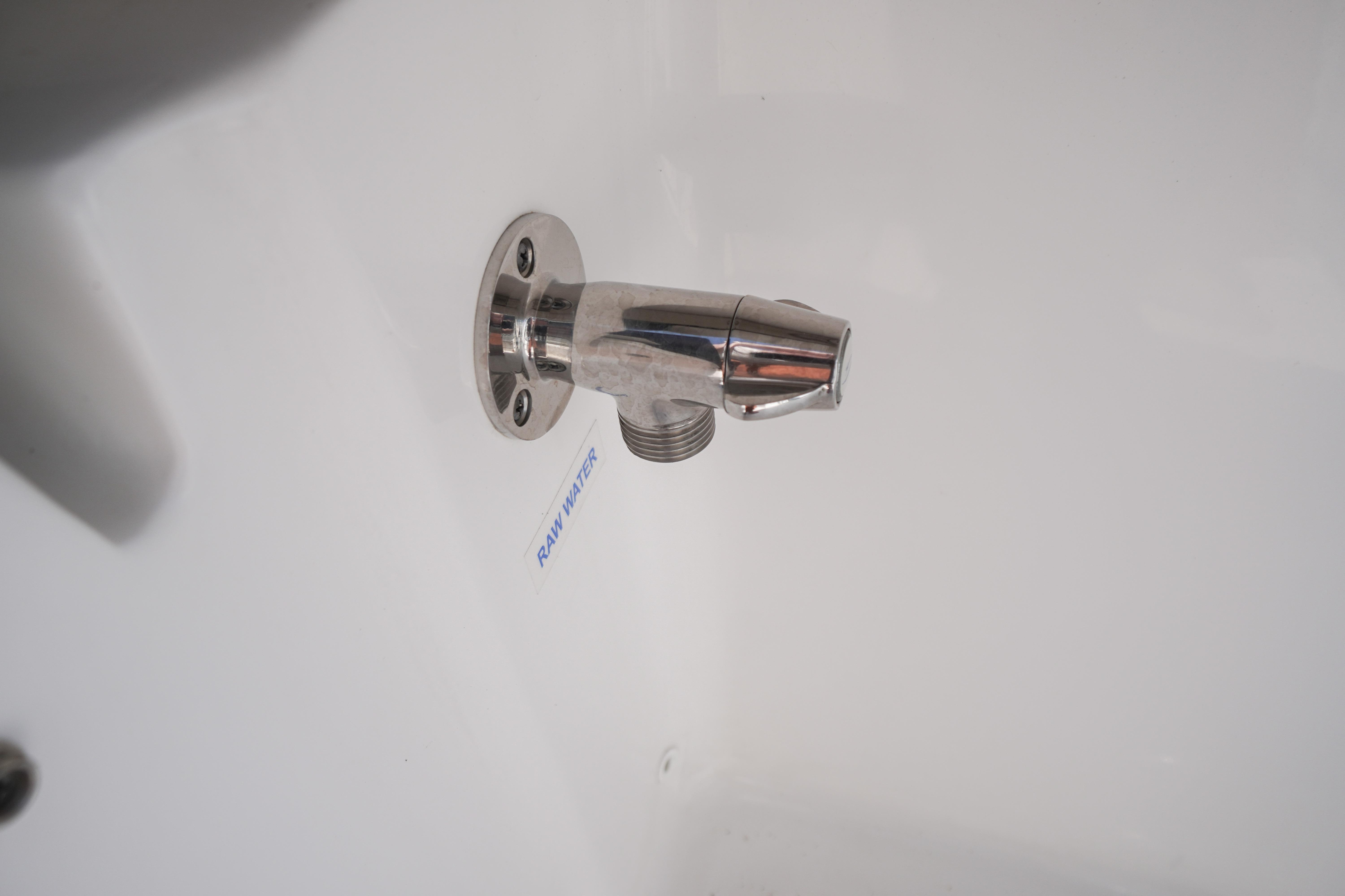 Chrome raw water outlet on 2025 Tidewater 232 SS boat.