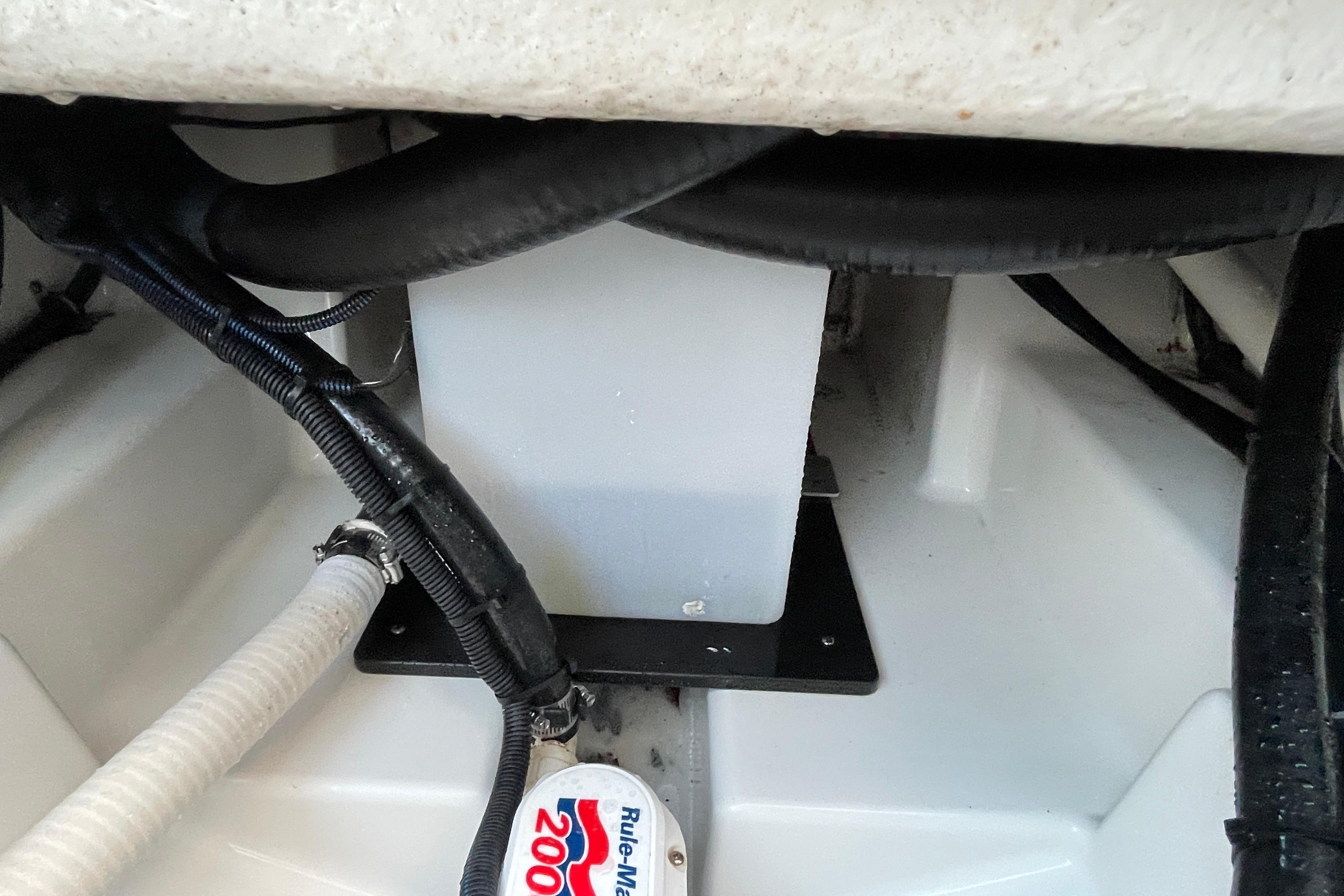 2022 Blackfin 252 CC boat interior showing wiring and pump components.