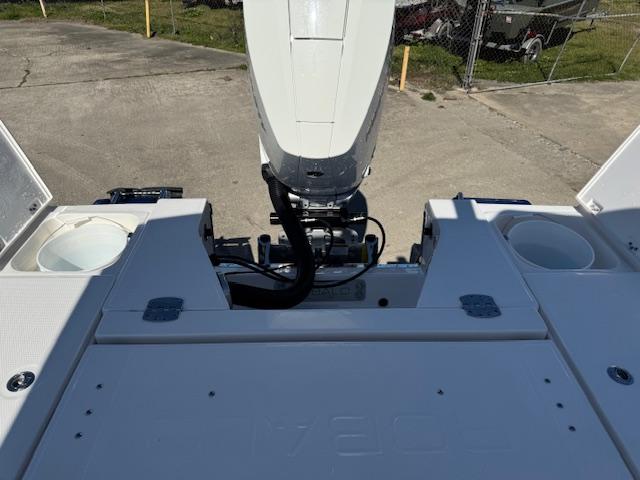 2025 Robalo 266 Cayman boat stern view with motor and storage compartments.