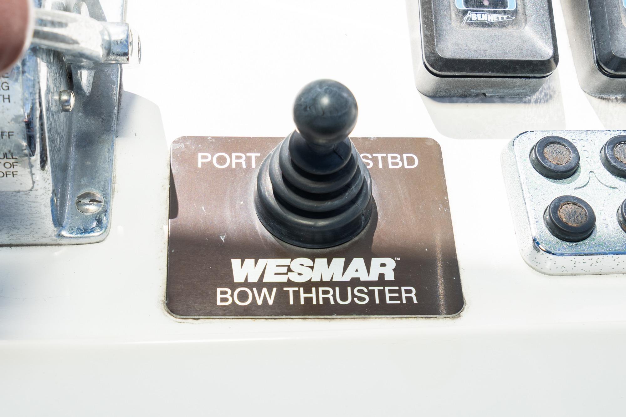 Control panel of a 1987 Grand Banks 46 Classic with Wesmar bow thruster joystick.