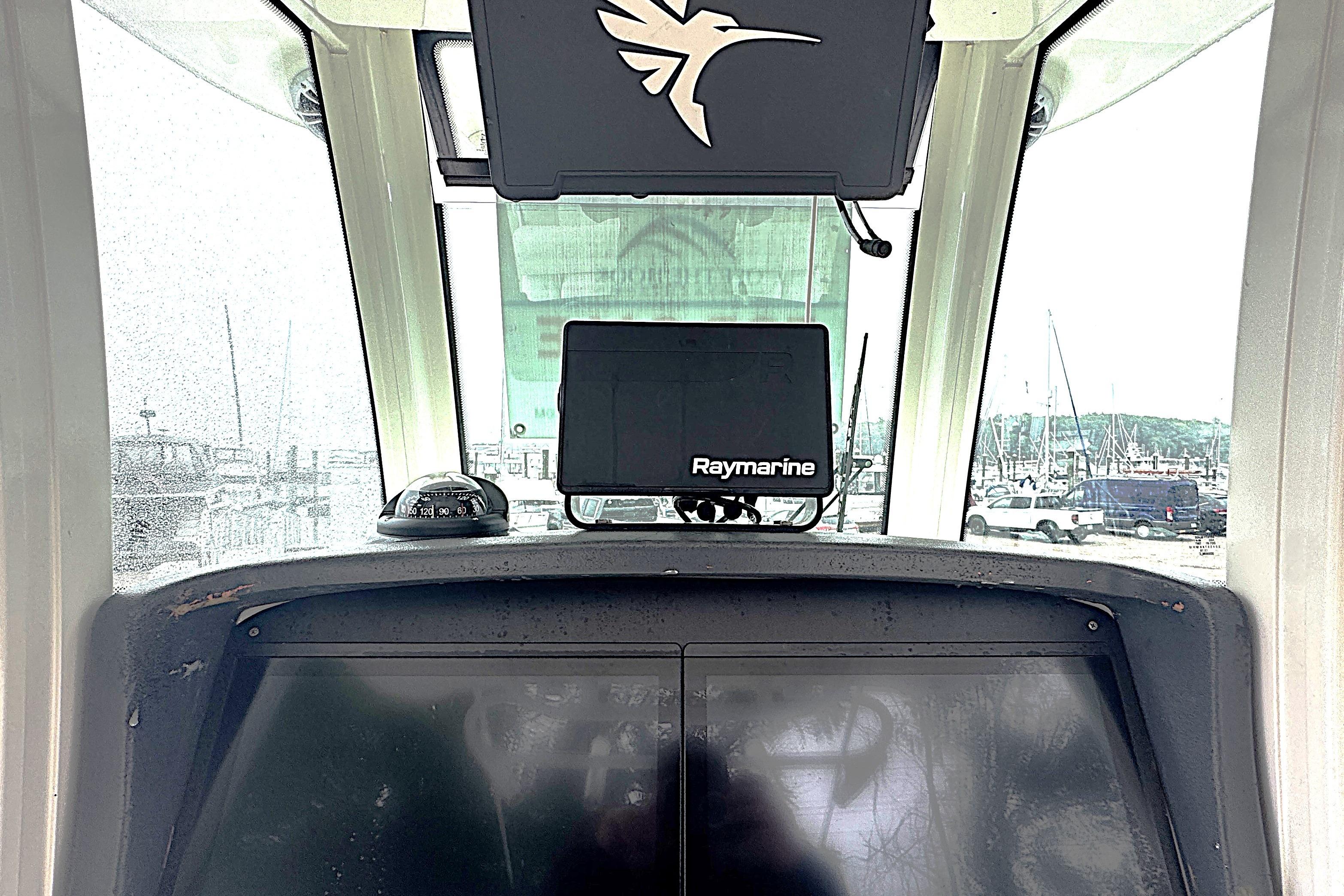 2014 Boston Whaler 250 Outrage helm with Raymarine navigation system.