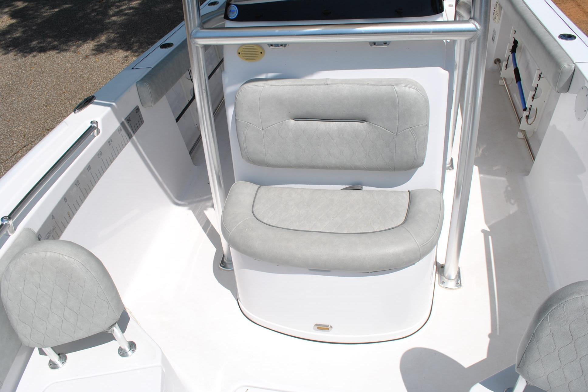 2020 Sportsman Open 232 Center Console boat interior with cushioned seating.