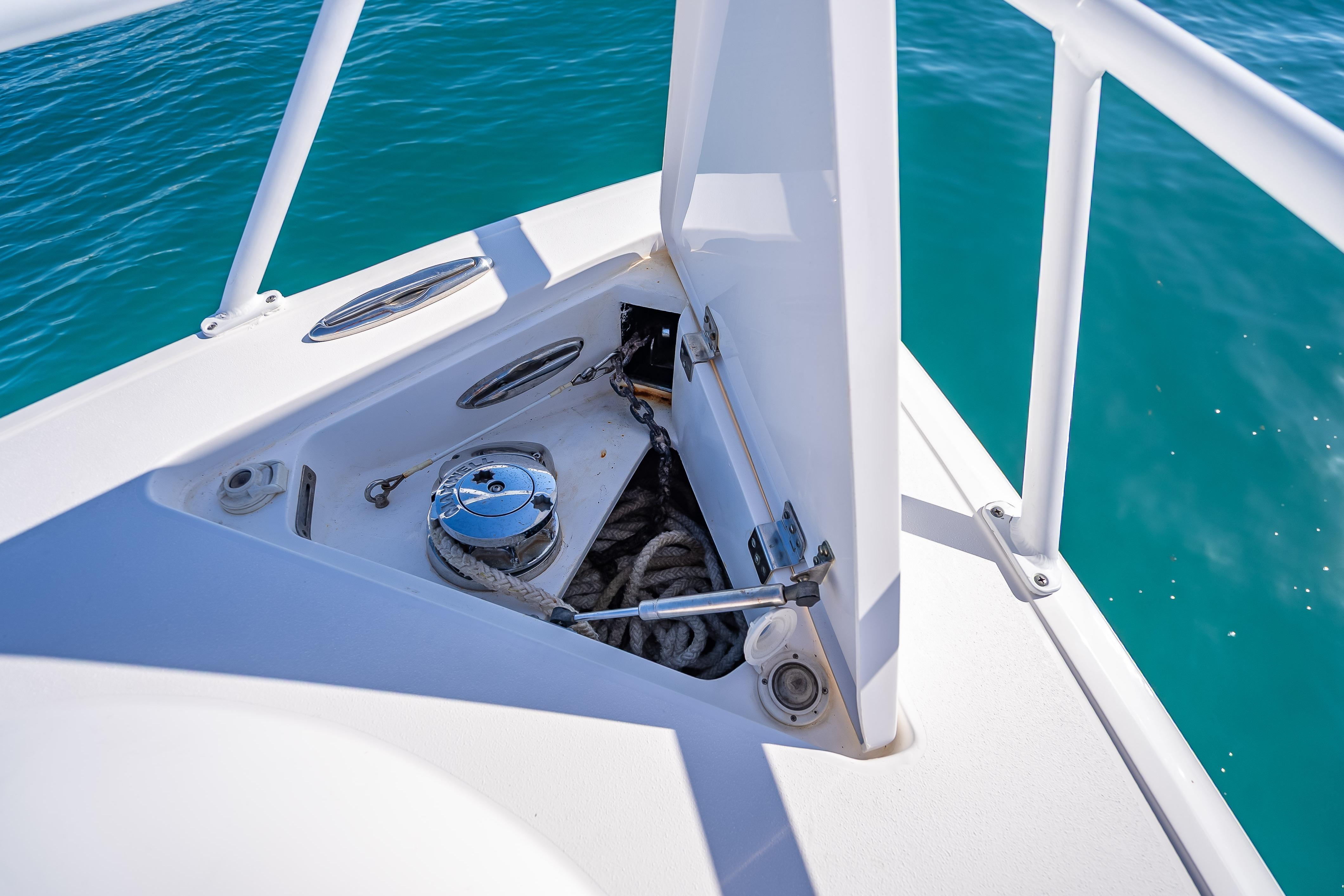Anchor storage compartment on 2016 Intrepid 375 Center Console boat, with turquoise water background.
