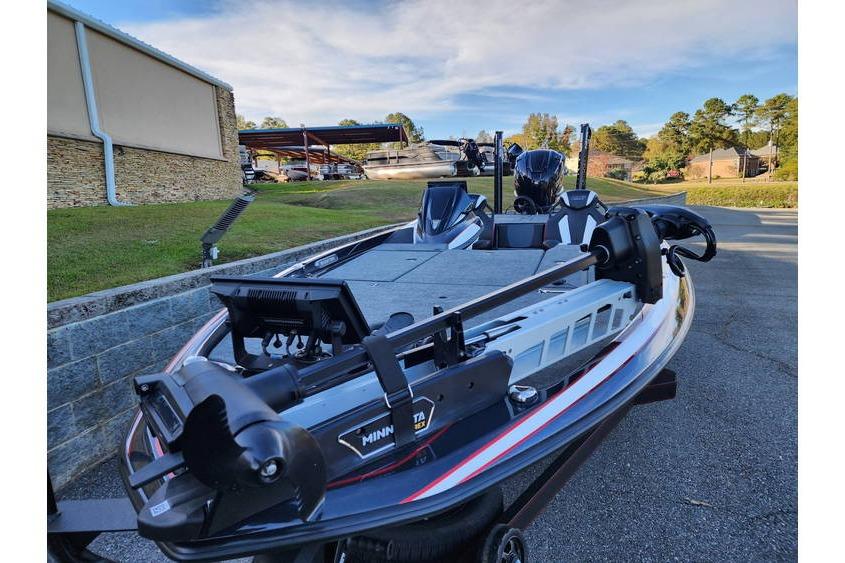 2026 Skeeter FXR21 Limited boat with Minn Kota trolling motor, parked outdoors.
