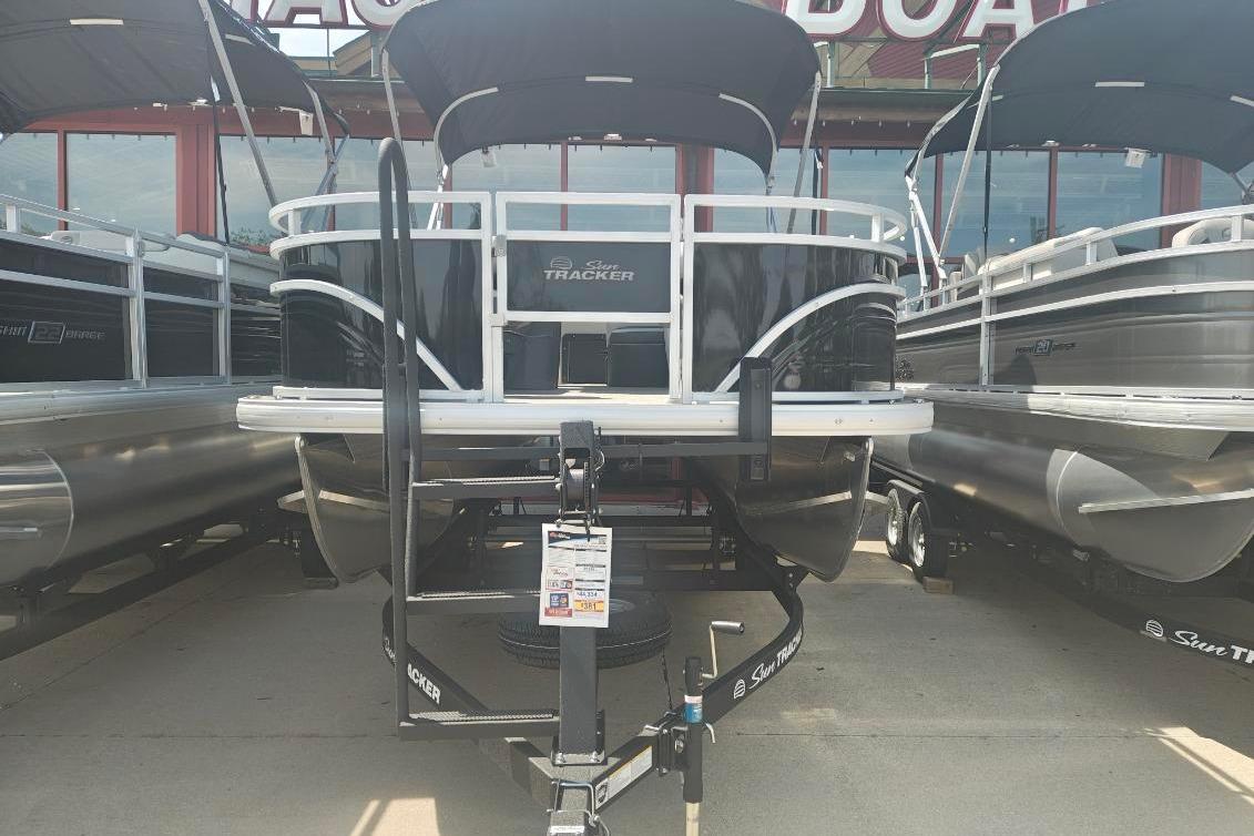 2026 Sun Tracker Fishin' Barge 20 DLX pontoon boat displayed at dealership.