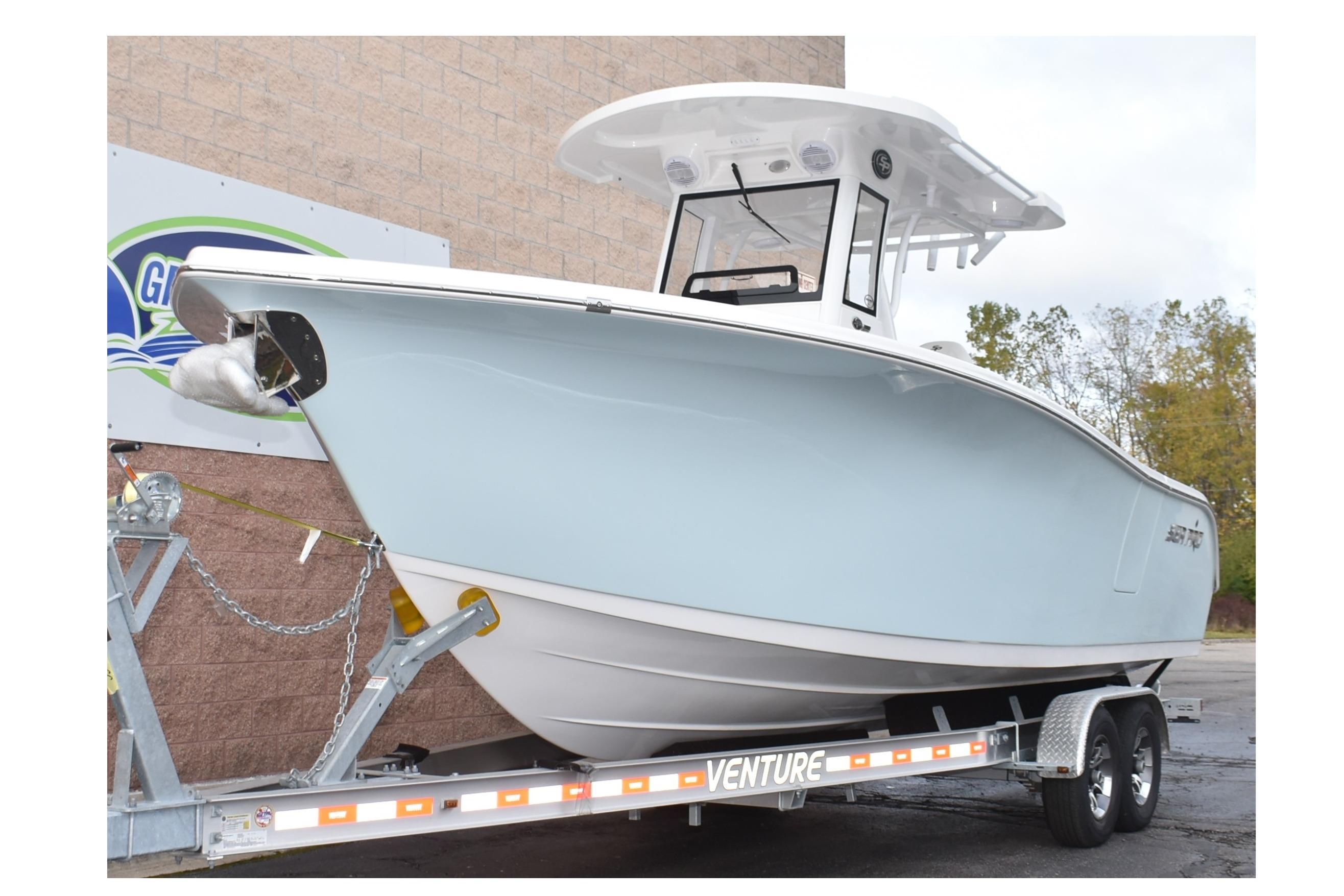 2025 Sea Pro 262 Offshore boat on trailer, side view.