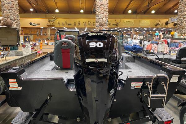 2025 Ranger VS1682SC Angler boat with Mercury 90 engine displayed indoors.