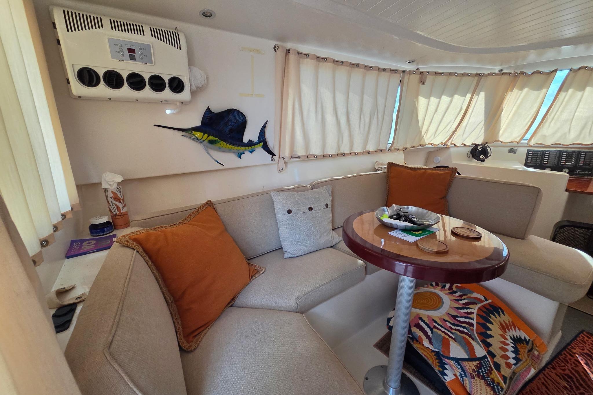 Cozy interior of 2000 Fountaine Pajot Maryland 37 yacht with seating and decor.