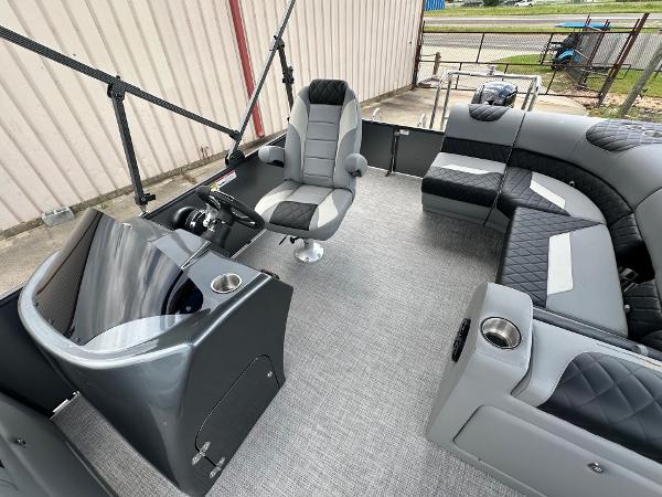 2024 Massimo Marine P-21R boat interior with captain's chair and cushioned seating.