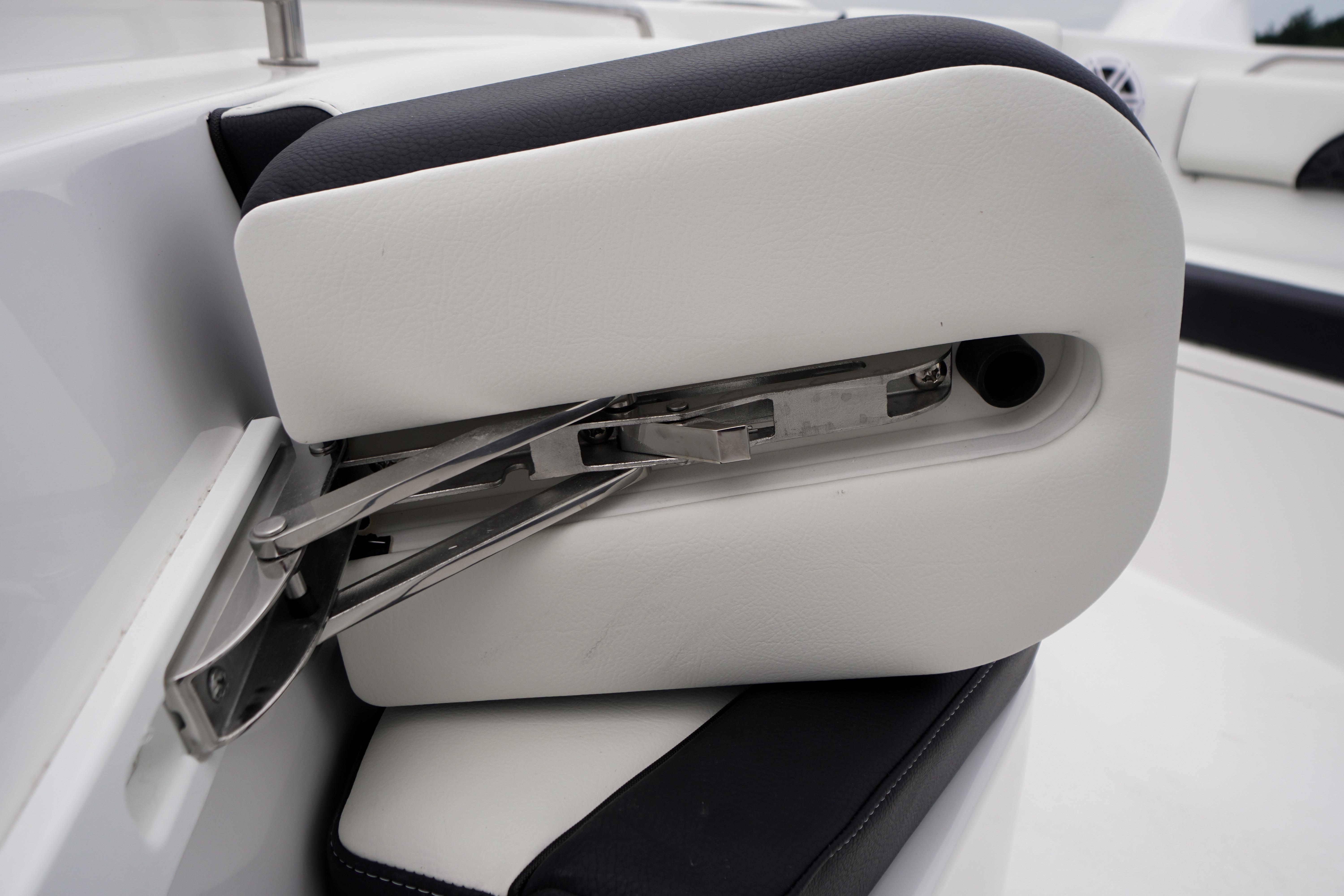 2026 Tidewater 232 SS boat seat detail with stainless steel hinge mechanism.