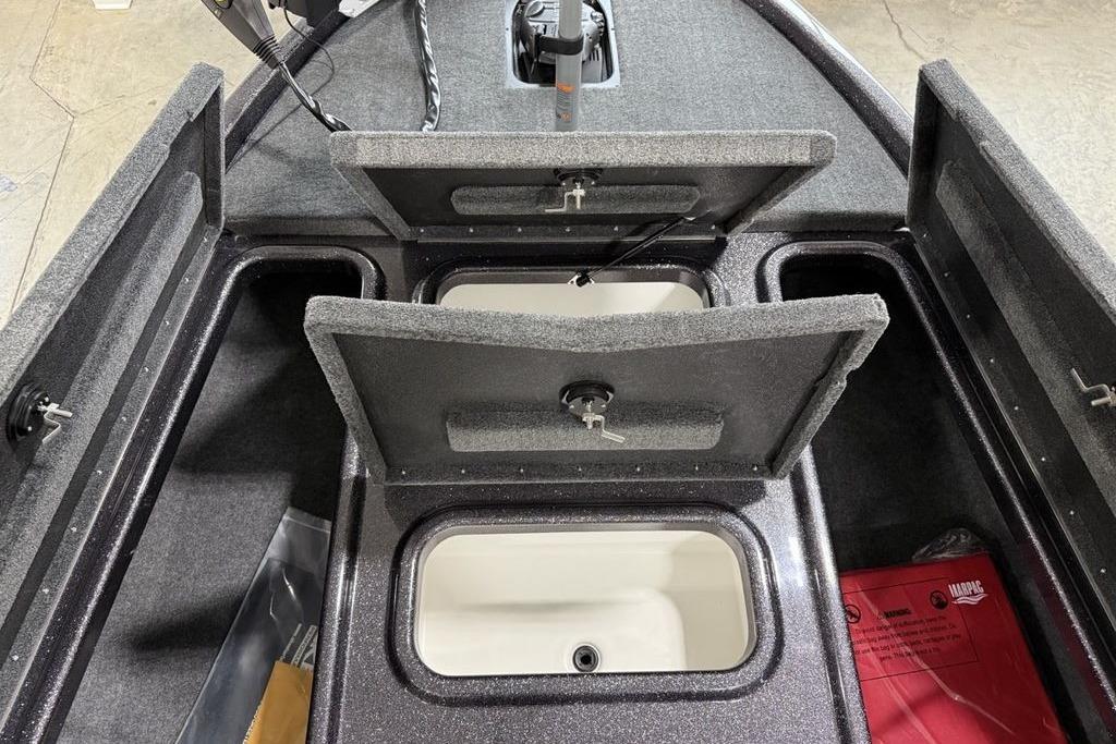 2025 Skeeter ZX150 boat storage compartments with open lids, showcasing interior design.