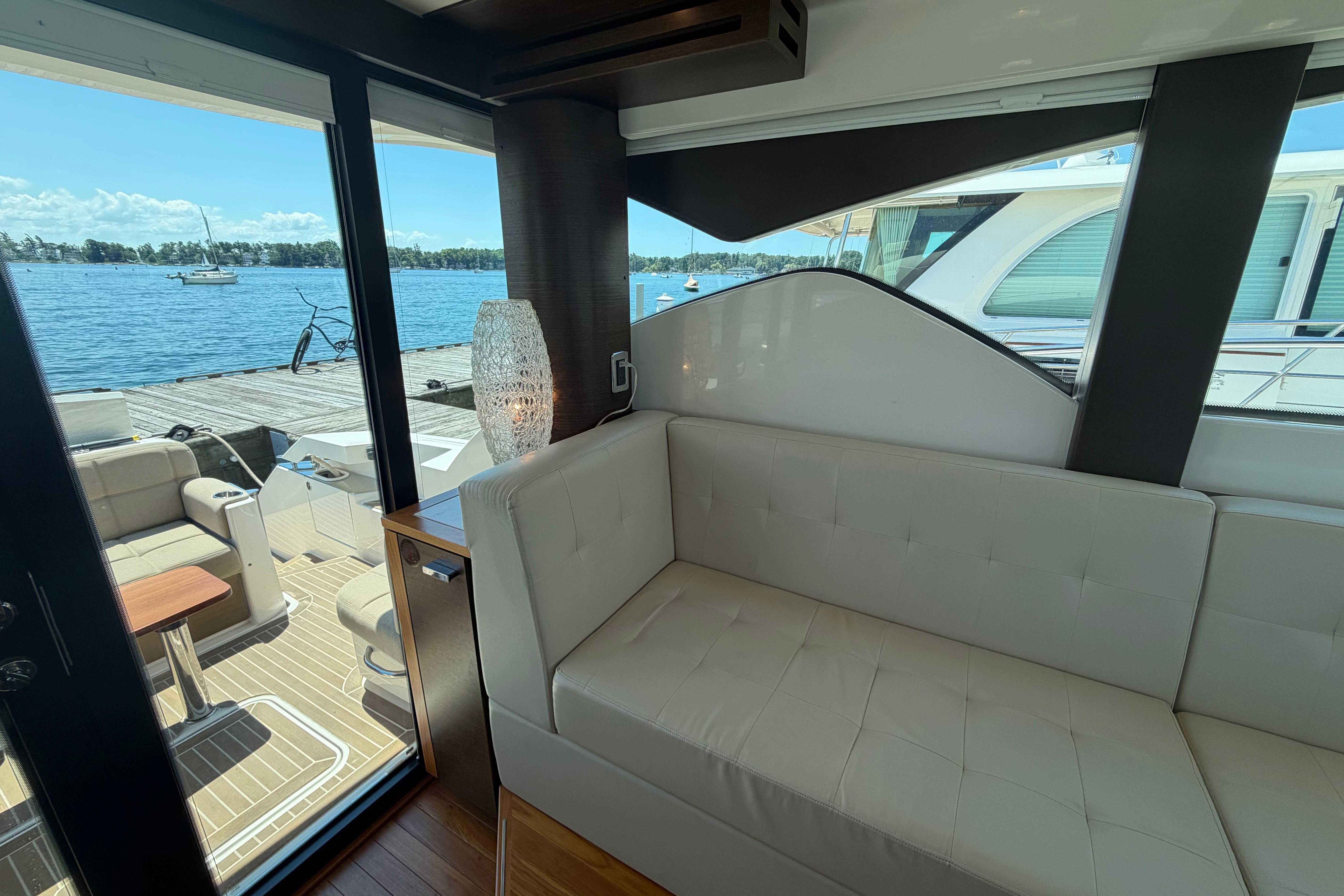 Interior view of 2016 Tiara Yachts C39 Coupe with waterfront backdrop.