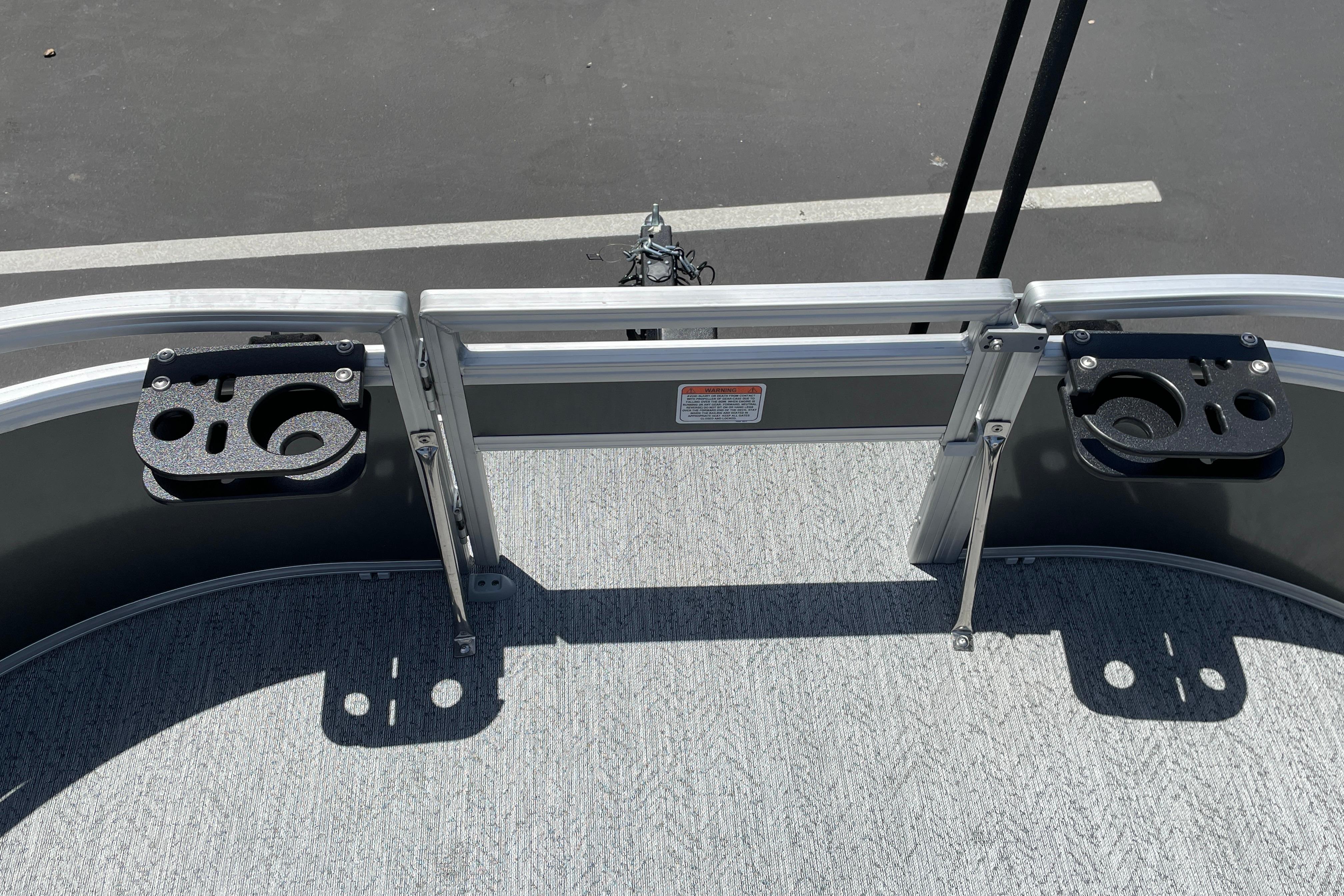 2026 Sun Tracker Bass Buggy 16 XL Select boat deck with cup holders and railing.