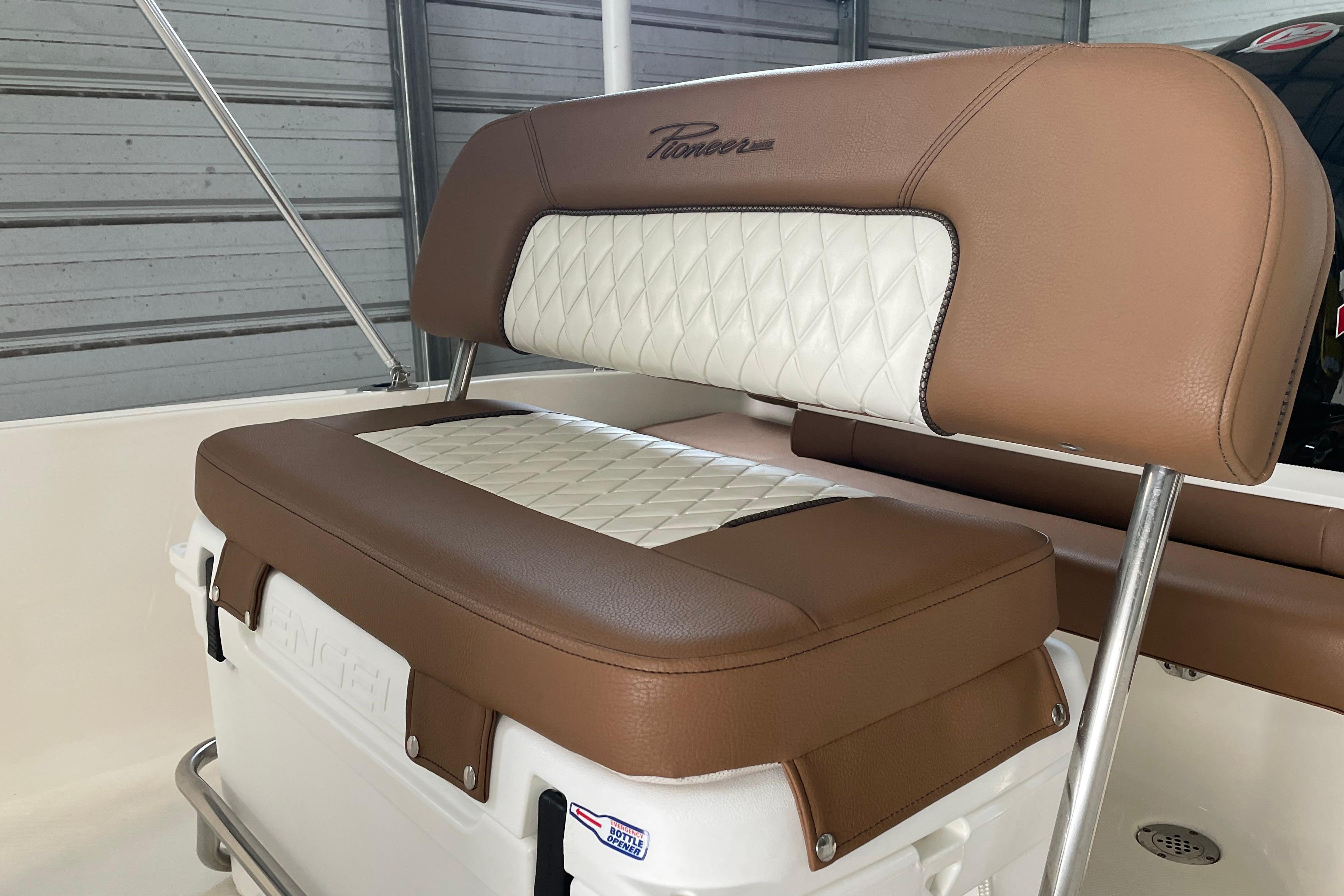 2024 Pioneer 180 Islander boat seat with brown and white cushioned design.
