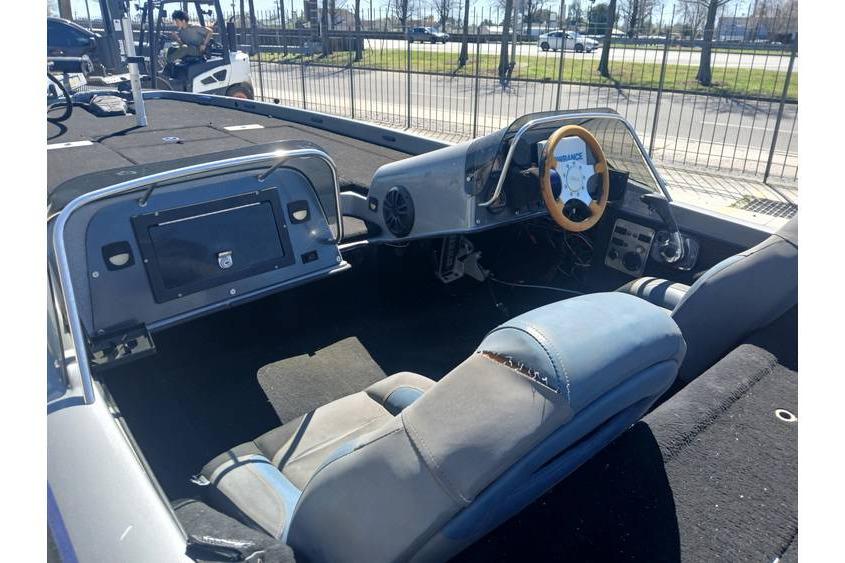 Interior of a 1994 Gambler 21 boat with a steering wheel and seating.