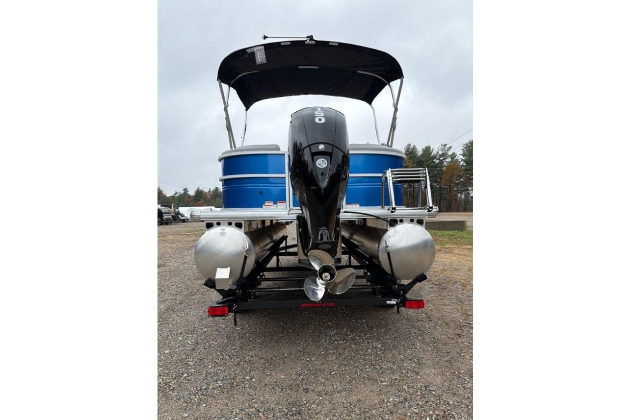 2026 Sun Tracker Party Barge 22 DLX pontoon boat, rear view with motor and canopy.