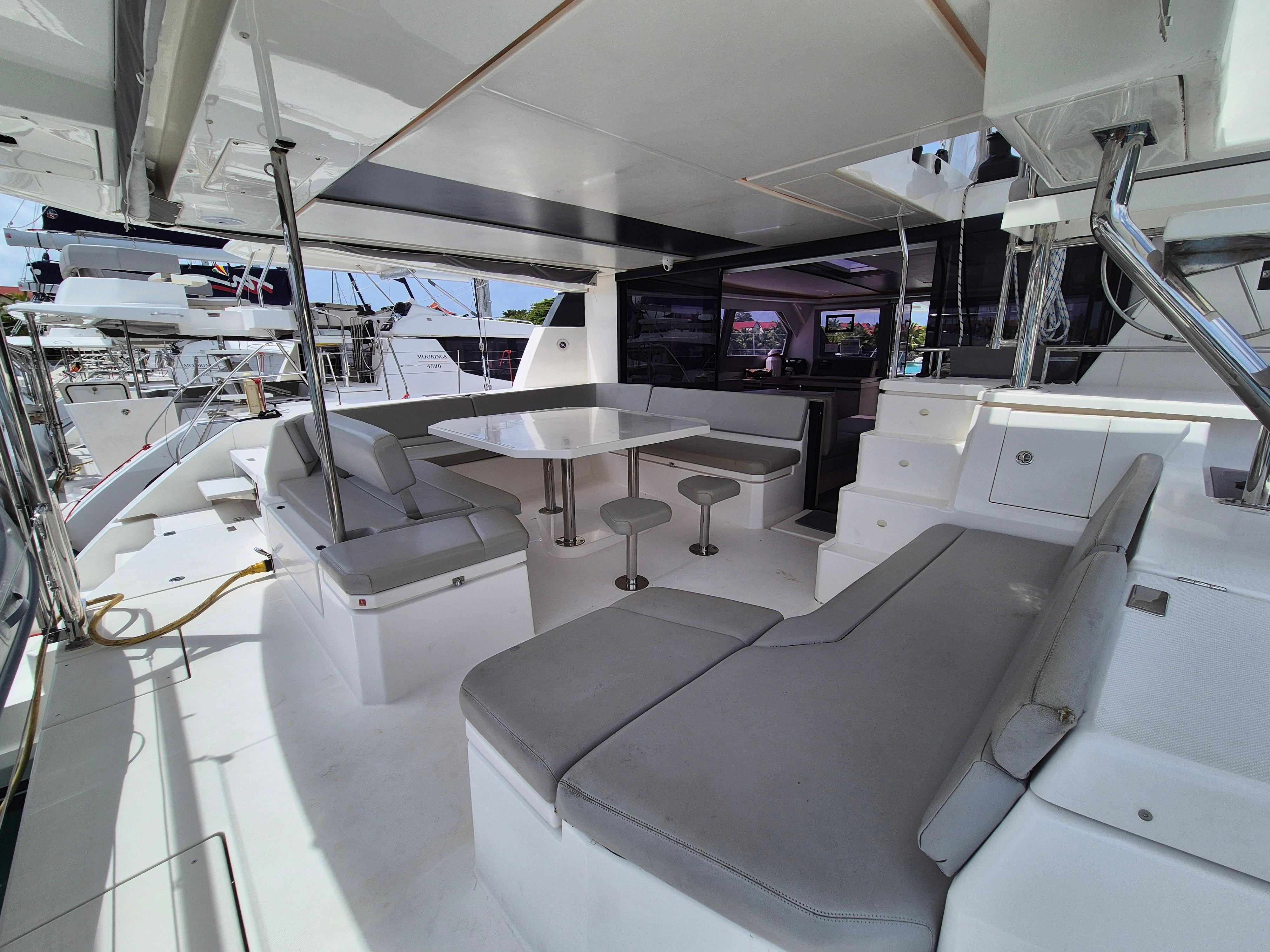 Spacious Leopard 50 yacht interior with modern seating and dining area, 2020 model.