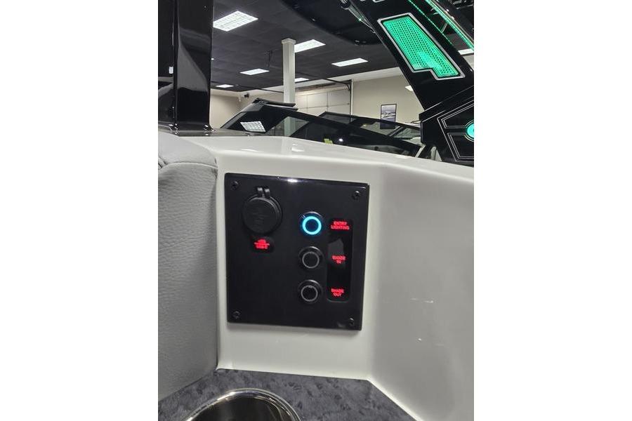 Control panel of 2026 Cobalt R31 boat with illuminated switches and modern design.