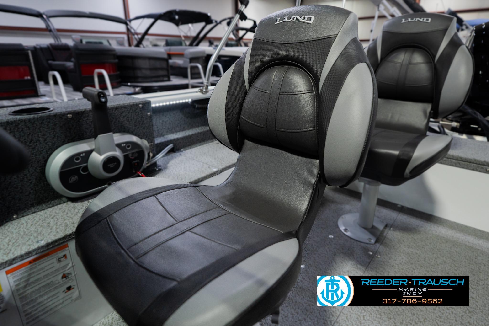 2026 Lund 1700 Explorer Sport boat interior with comfortable seating and control panel.