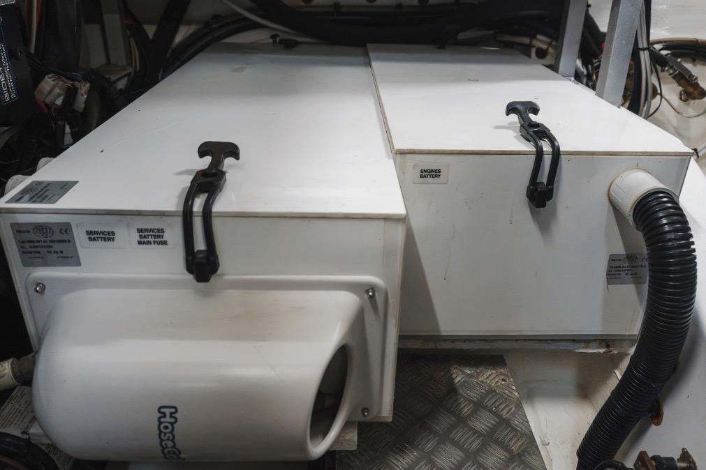 Battery compartment of a 2020 Azimut 60 yacht, featuring labeled service and engine batteries.