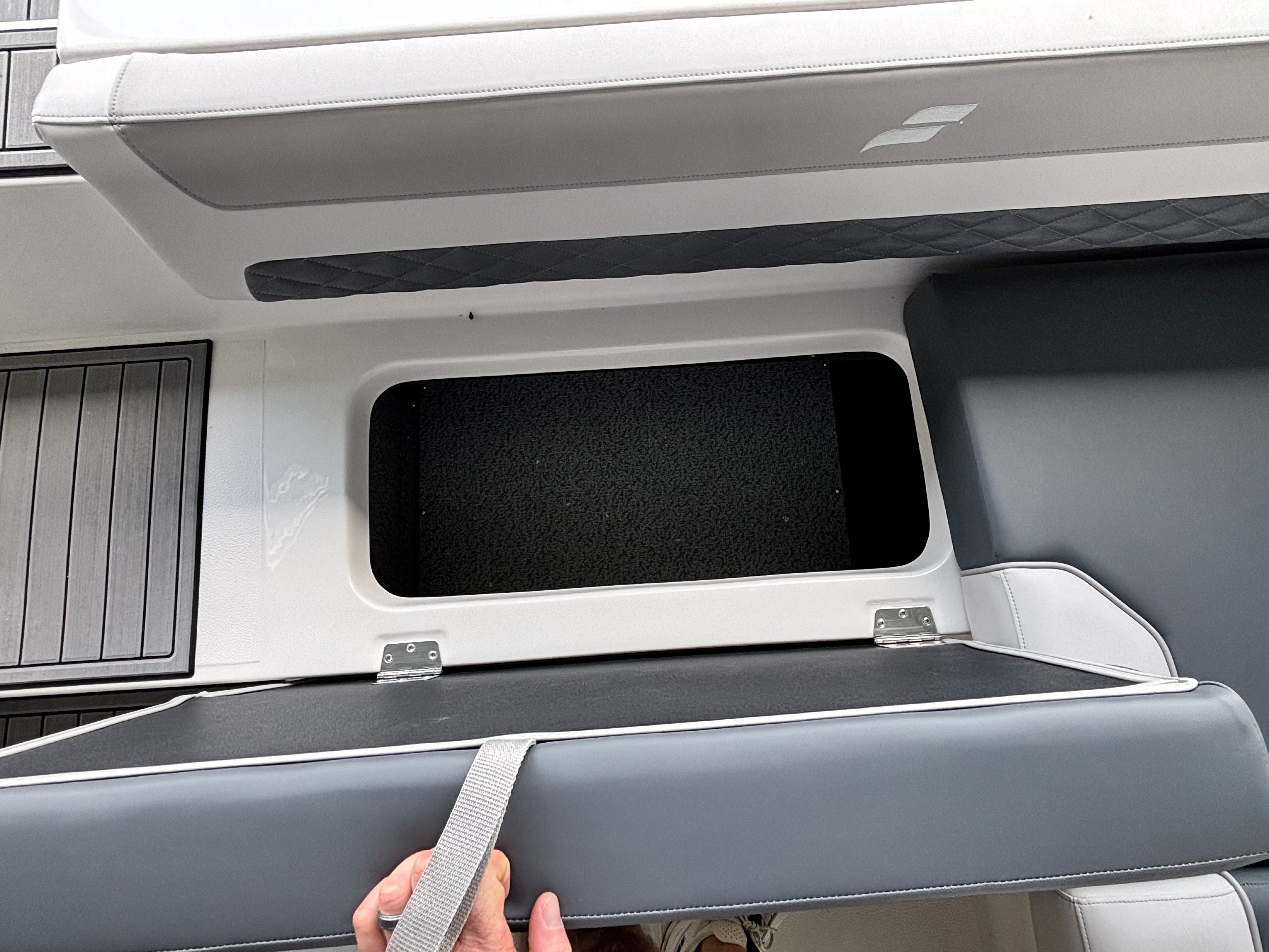 A storage compartment on a 2027 Starcraft 211SVXOB boat.