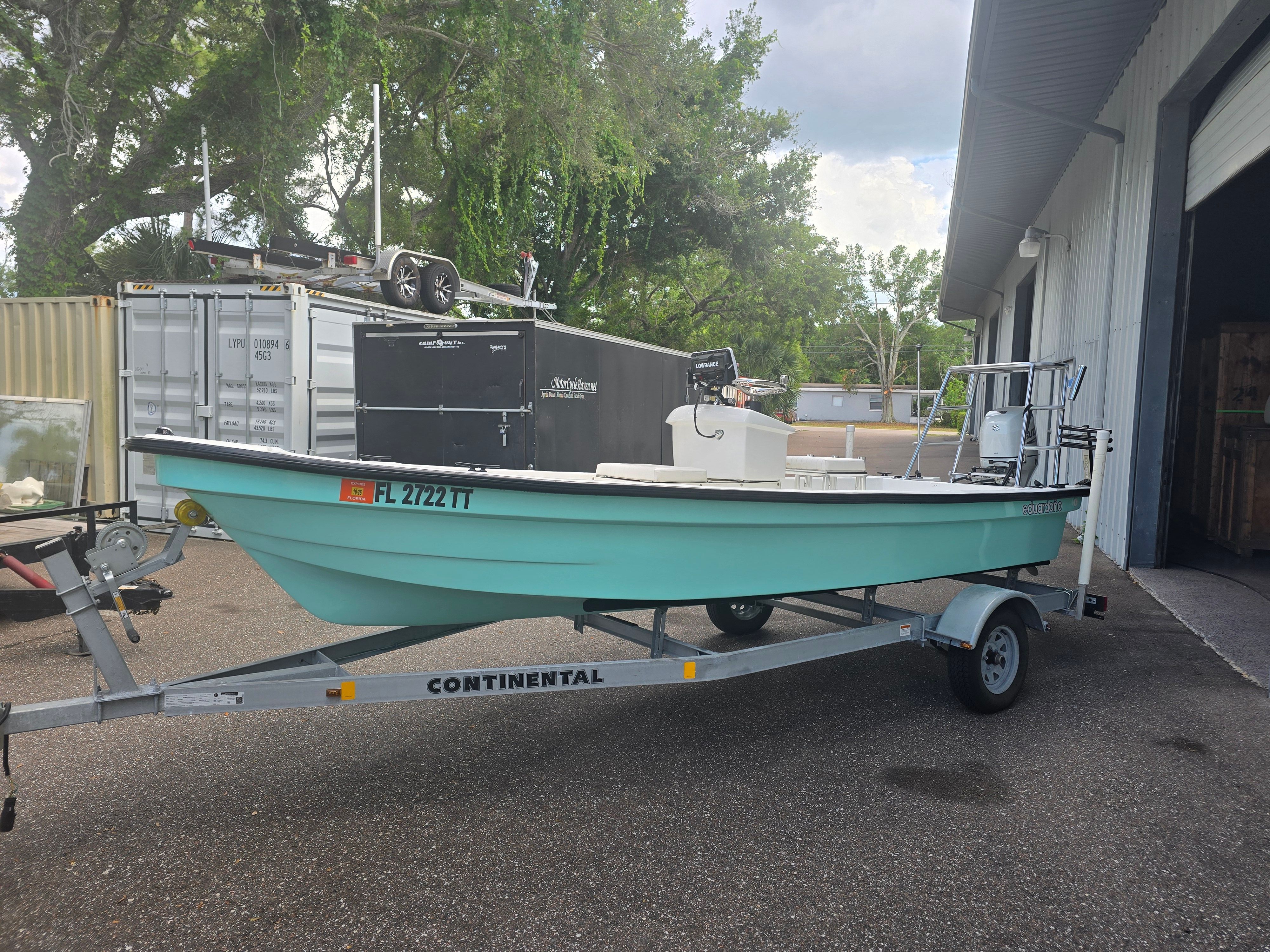 2022 Panga Eduardono boat on trailer outside warehouse.