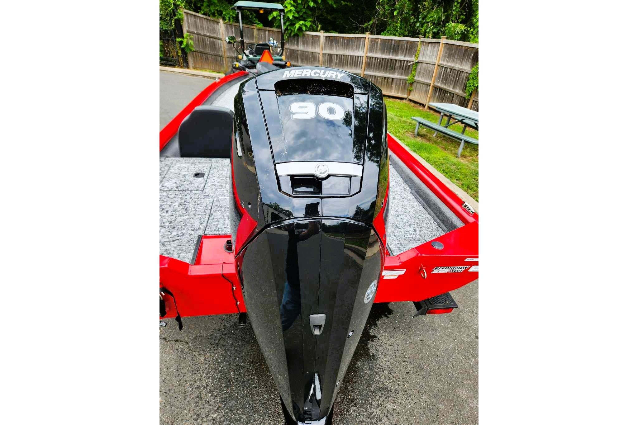 2026 Tracker Pro Team 190 boat with Mercury 90 engine, red and gray design.