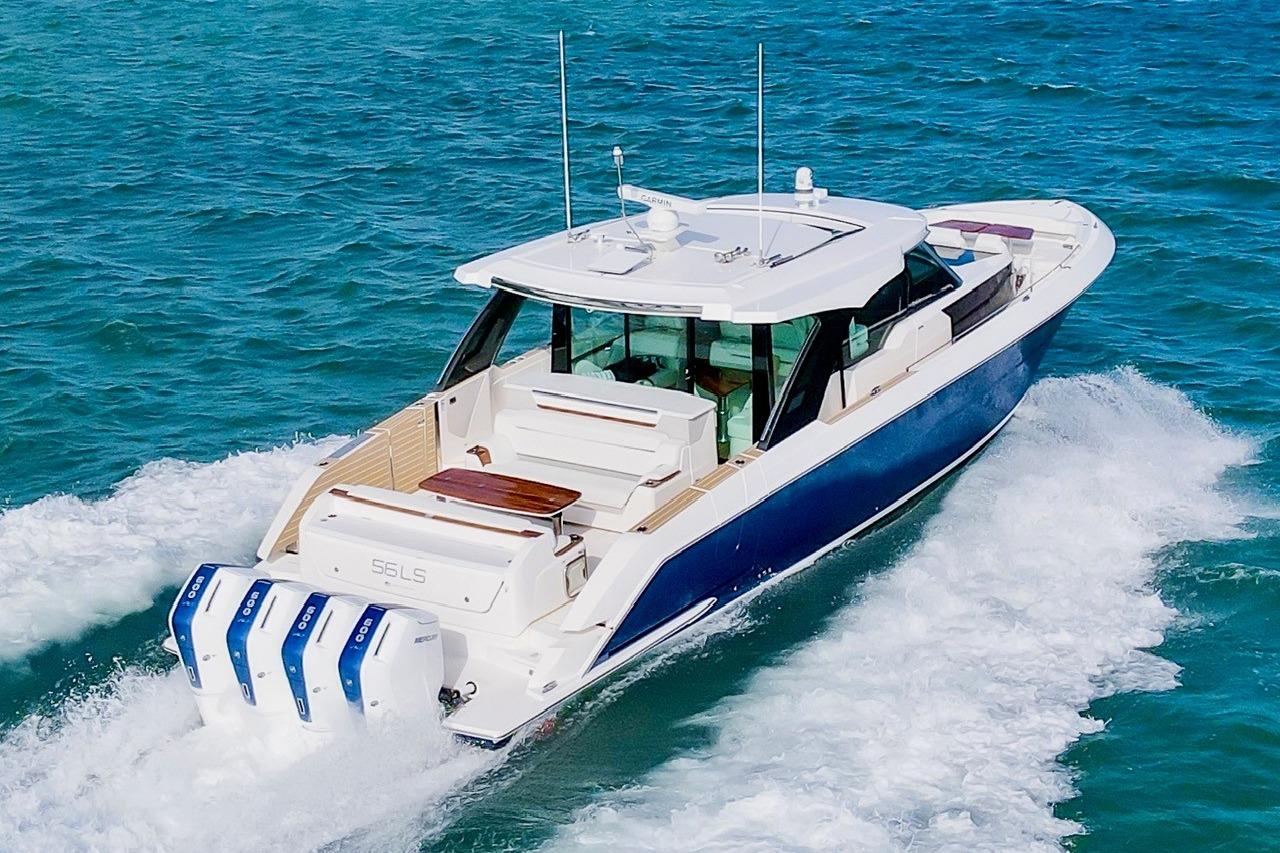 2026 Tiara Yachts 56 LS cruising on open water, showcasing sleek design and powerful engines.