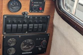 Dashboard with Yanmar gauges and control panel.