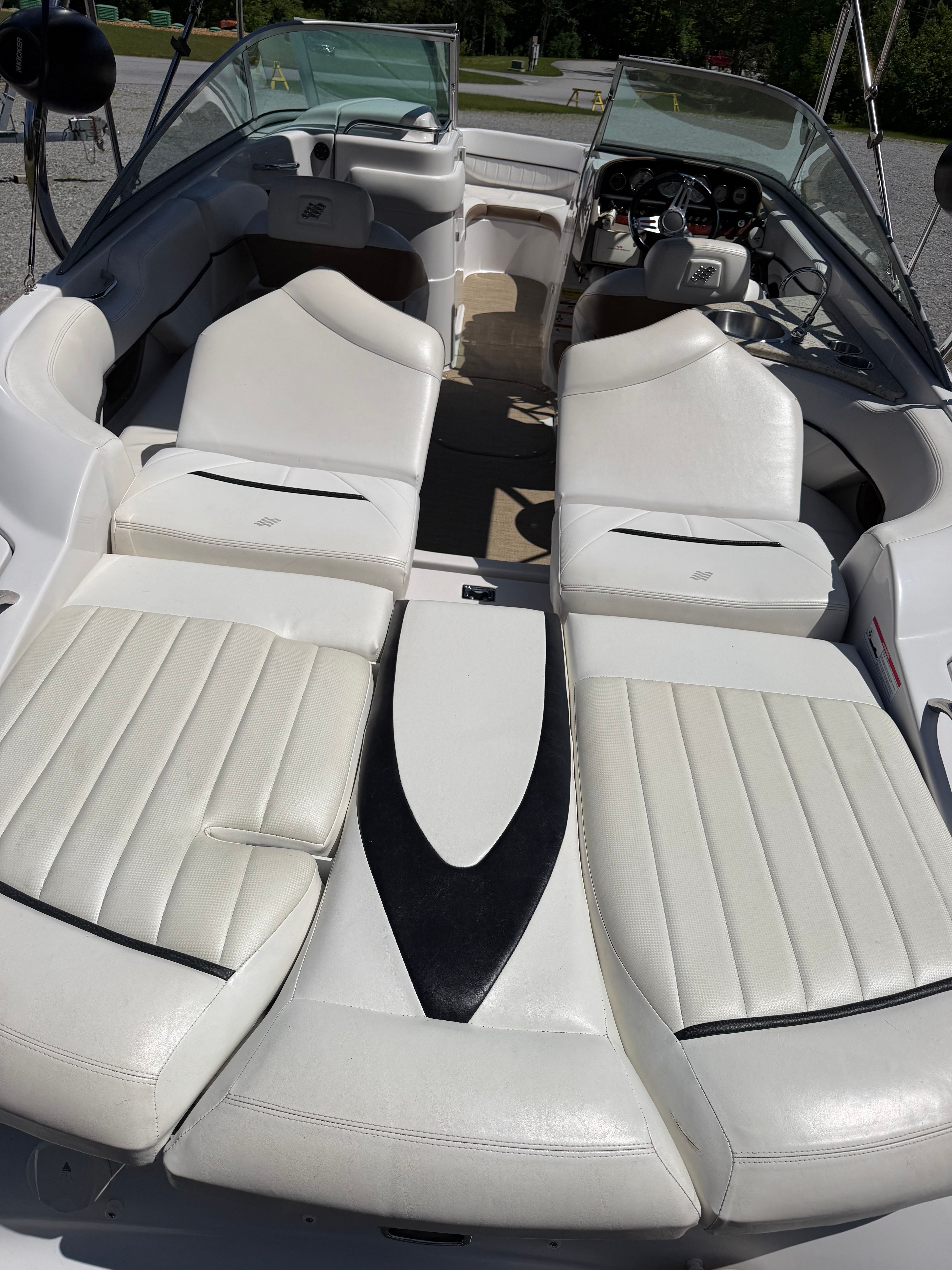The image shows the interior of a 2008 Four Winns H240 Frenzy boat with white leather seats.