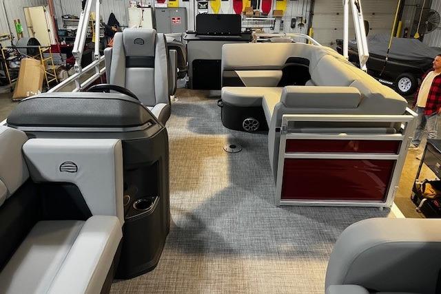 2026 Sun Tracker SportFish 22 DLX pontoon boat interior with spacious seating and modern design.