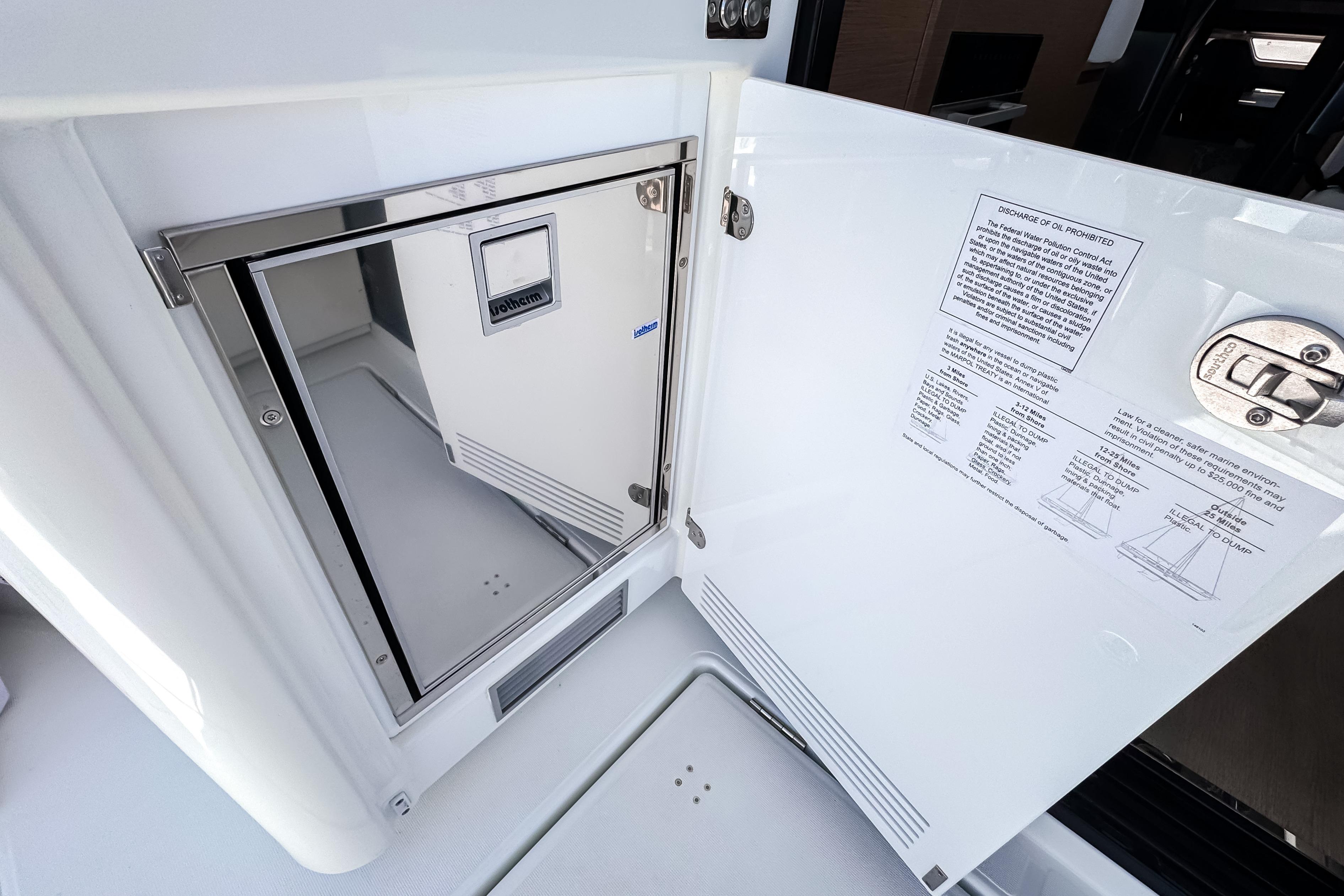 Interior of 2026 Wellcraft 44 Explorer with stainless steel cabinet.